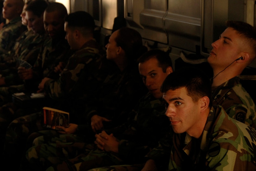 Airmen from Charleston AFB act as extras during a scene inside a C-17 on Charleston AFB Dec. 4 for the upcoming movie "Dear John". The production company received permission from the Defense Department to use base aircraft, facilities and Airmen to highlight the global airlift mission portrayed in the movie. (U.S. Air Force photo/Senior Airman Timothy Taylor)
