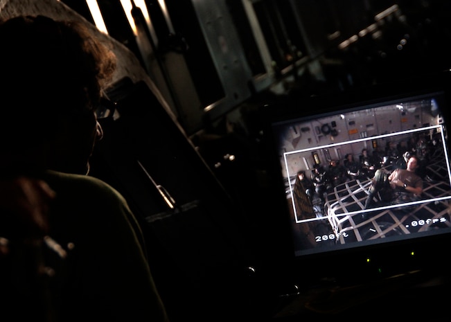 Directors from the film "Dear John" guide cameramen frame by frame to capture the scene needed for the filming inside a C-17 on Charleston AFB Dec. 4. The production company received permission from the Defense Department to use base aircraft, facilities and Airmen to highlight the global airlift mission portrayed in the movie. (U.S. Air Force photo/Senior Airman Timothy Taylor)
