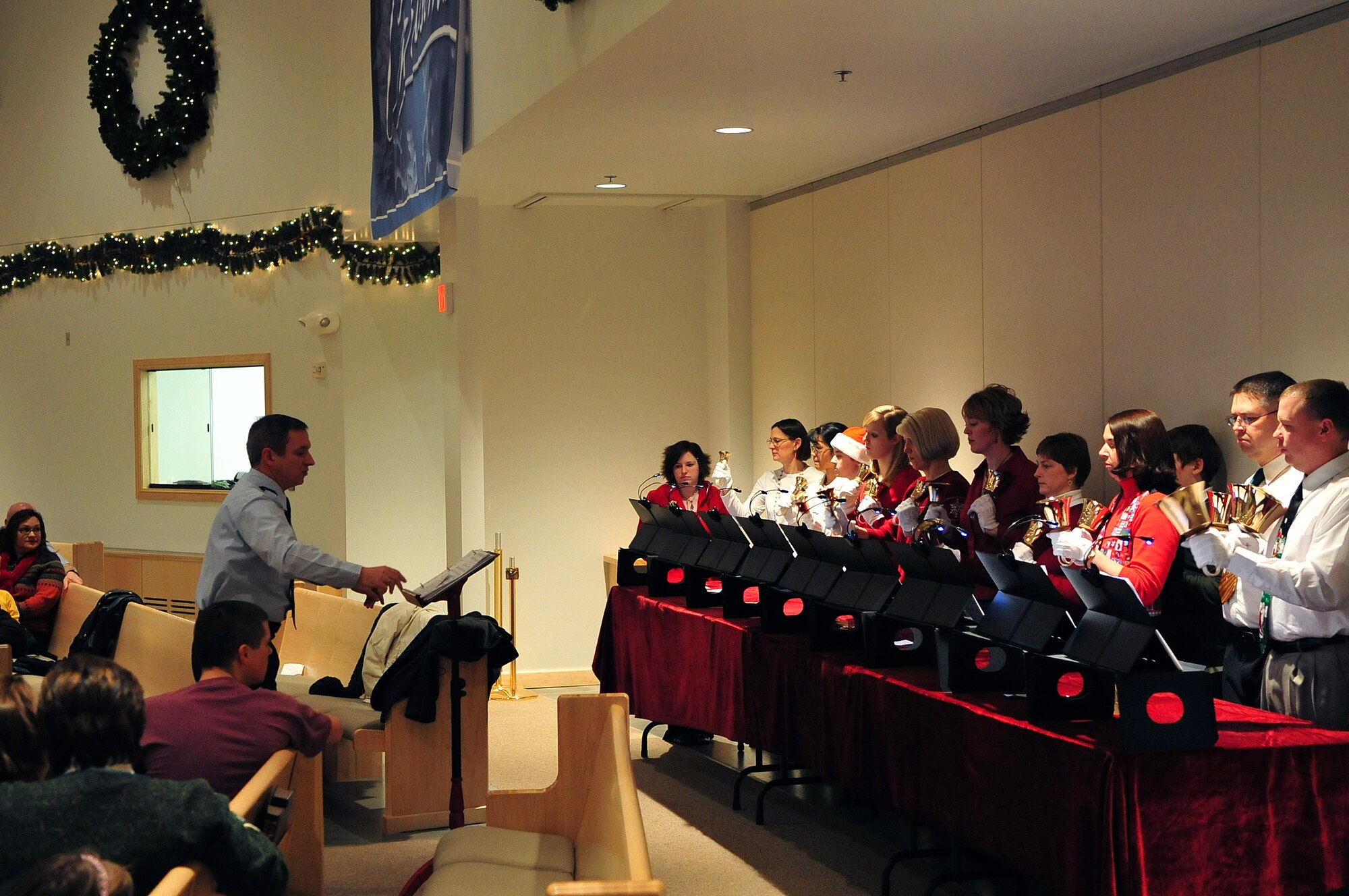 The Eielson Air Force Base Hand Bell Choir performs "Joy to the World" Dec. 8 at the Christmas Tree Lighting Ceremony. The ceremony started in the new base chapel and finished outside with the lighting of the base Christmas tree. (U.S. Air Force photo by Airman 1st Class Willard E. Grande II)