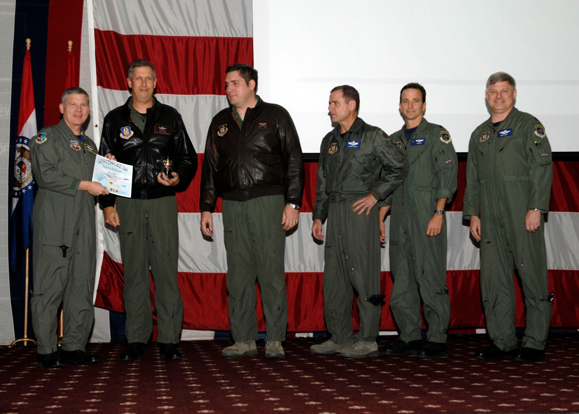 Lt. Gen. Robert Elder, 8th Air Force commander, presents Lt. Col Rob Burgess, Capt Jesse Hildebrand, Lt. Col Steve Smith, Lt. Col. Dennis Heinz, and Lt. Col Rick Holt the Buff Smoke 2008 best crew award on Dec 5 at Barksdale AFB, La.  