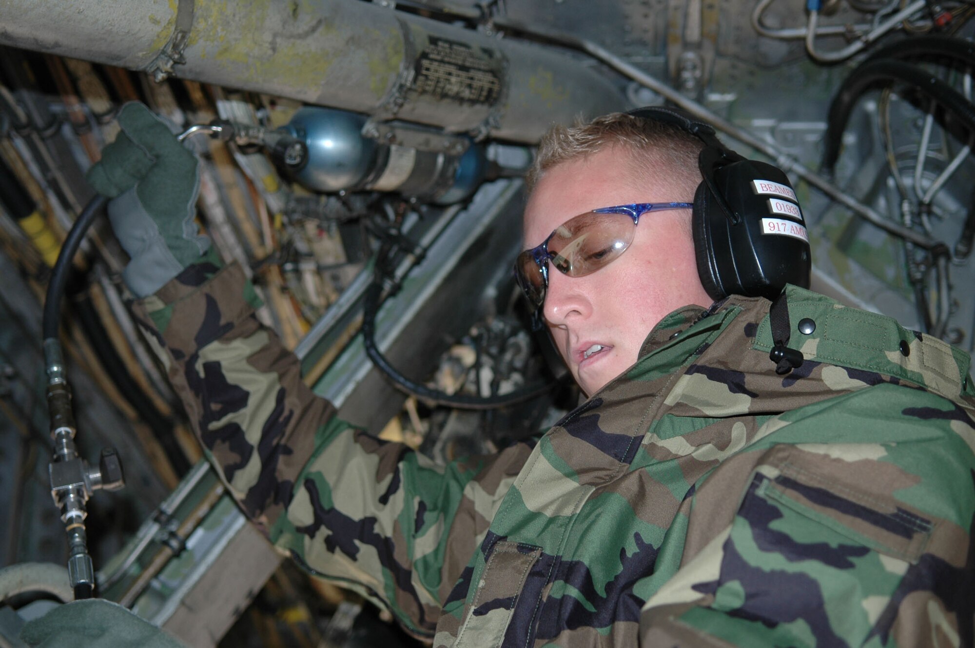 Staff Sgt. Bradley Beames, Assistant Crew Chief, 917th Aircraft Maintenance Squadron, services a hydraulic accumulator on a B-52.  Sgt. Beames was part of the team that won Best Crew Chiefs at Buff Smoke 2008 held here at Barksdale AFB, La. in December.