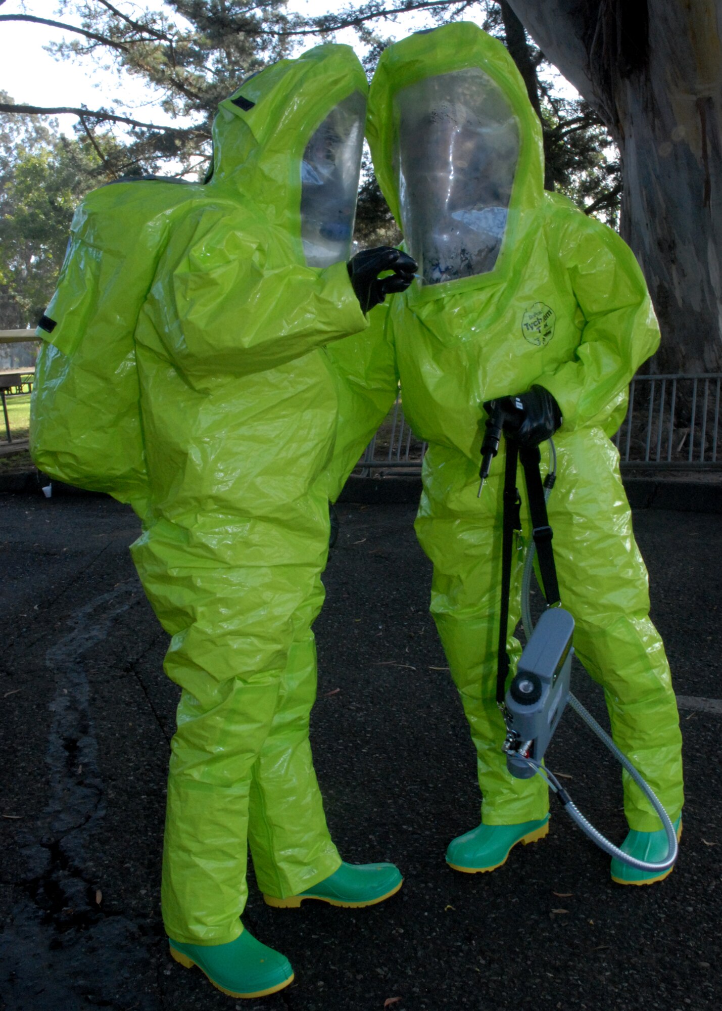 VANDENBERG AIR FORCE BASE, Calif.-- Senior Airman Patrick Mckee and Senior Airman Samiel McIntyre read the results from a litmus paper testing strip during an intial assesment at a RECON exercise in Cocheo Park. (U S. Air Force photo/Airman 1st Class Antoinette Lyons)