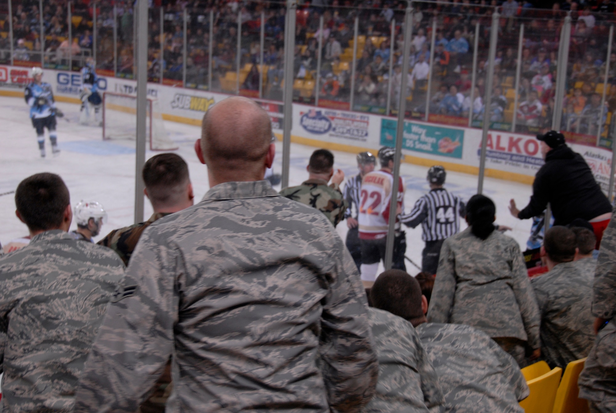 ANCHORAGE, Alaska -- Airmen watch the action unfold during the Alaska Aces' military appreciation game Dec. 6. Several members of Elmendorf leadership and Gen. Carrol "Howie" Chandler, Pacific Air Forces commander, attended this year's game. More than 200 uniformed servicemembers attended this year's game. The Aces beat the Bakersfield Condors 6-0. (U.S. Air Force photo/Airman 1st Class Cynthia Spalding)