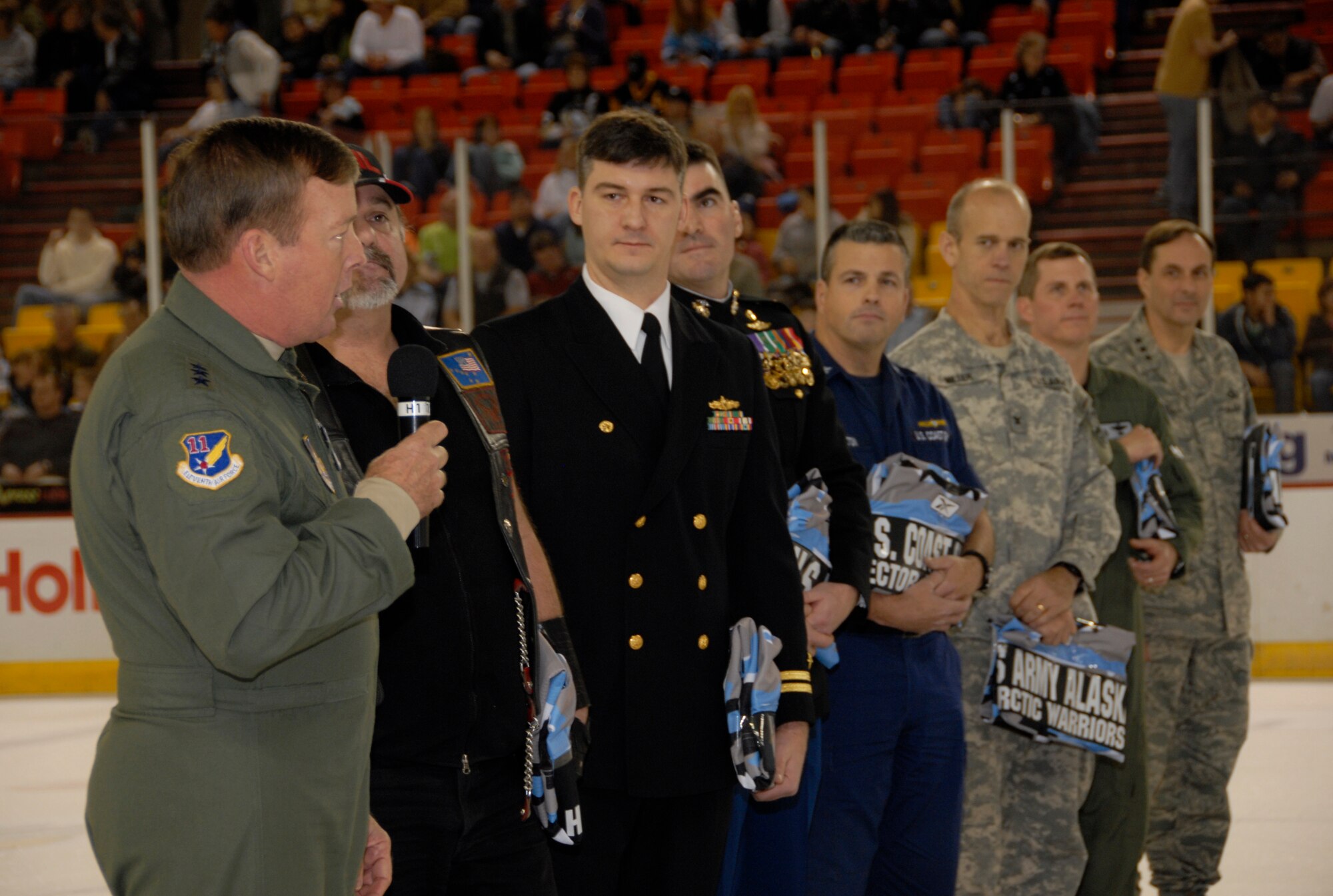 ANCHORAGE, Alaska -- Lt. Gen. Dana T. Adkins addresses fans during the first intermission at the Alaska Aces' military appreciation game Dec. 6. All the VIP officers attending the event were presented Aces team autographed military jerseys during the intermission. General Atkins is the commander of Alaska Command, 11th Air Force, Alaska NORAD Region and Joint Task Force-Alaska. (U.S. Air Force photo/Airman 1st Class Cynthia Spalding)
