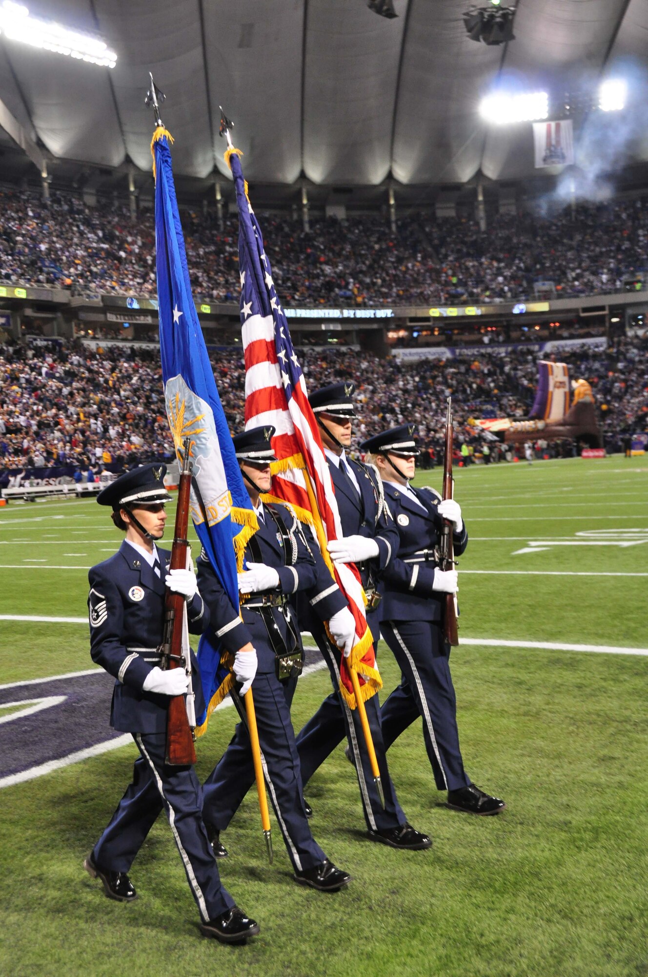 The 934th Airlift Wing Color Guard presents the colors at the Minnesota Vikings vs. Chicago Bears game Nov. 30.  From left to right are Master Sgt. Stephanie Belle-Isle, Master Sgt. Mary Miller, Senior Master Sgt. Doug Johnson and Staff Sgt. Lindsay Rosenow.  The Vikings went on to defeat the Bears 34-14. (Air Force Photo/Master Sgt. Paul Zadach)


