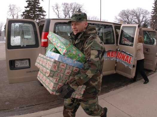 Senior Master Sgt. Paul Tangen, N.D. Air National Guard, helps unload presents for Veterans at the North Dakota Veterans Home in Lisbon, N.D. on December 19, 2007.
