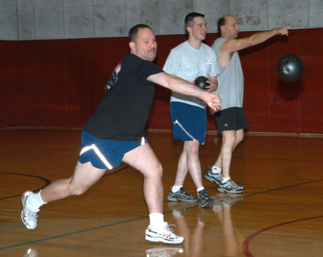 GRISSOM AIR RESERVE BASE, Ind., -- Three members of the 434th Air Refueling Wing take aim during the recent dodge ball tournament held at the base fitness center.  The 434th Services Flight holds a number of special events after duty hours to promote physical fitness.  (U.S. Air Force photo/Staff Sgt. Ben Mota)                              