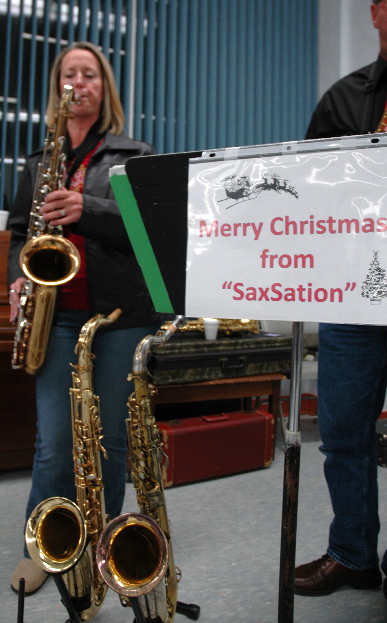 EGLIN AIR FORCE BASE, Fla. -- Team Eglin enjoyed some cheerful holiday music from SaxSation during the Holiday Tree Lighting ceremony hosted at the West Gate Chapel Dec. 5. Team Eglin celebrated together in anticipation of the upcoming holiday season with christmas carols, cookies, cocoa, and of course the opportunity for to sit on Santa's lap and tell him how good you've been. (U.S. Air Force photo/ Airman 1st Class Anthony Jennings)