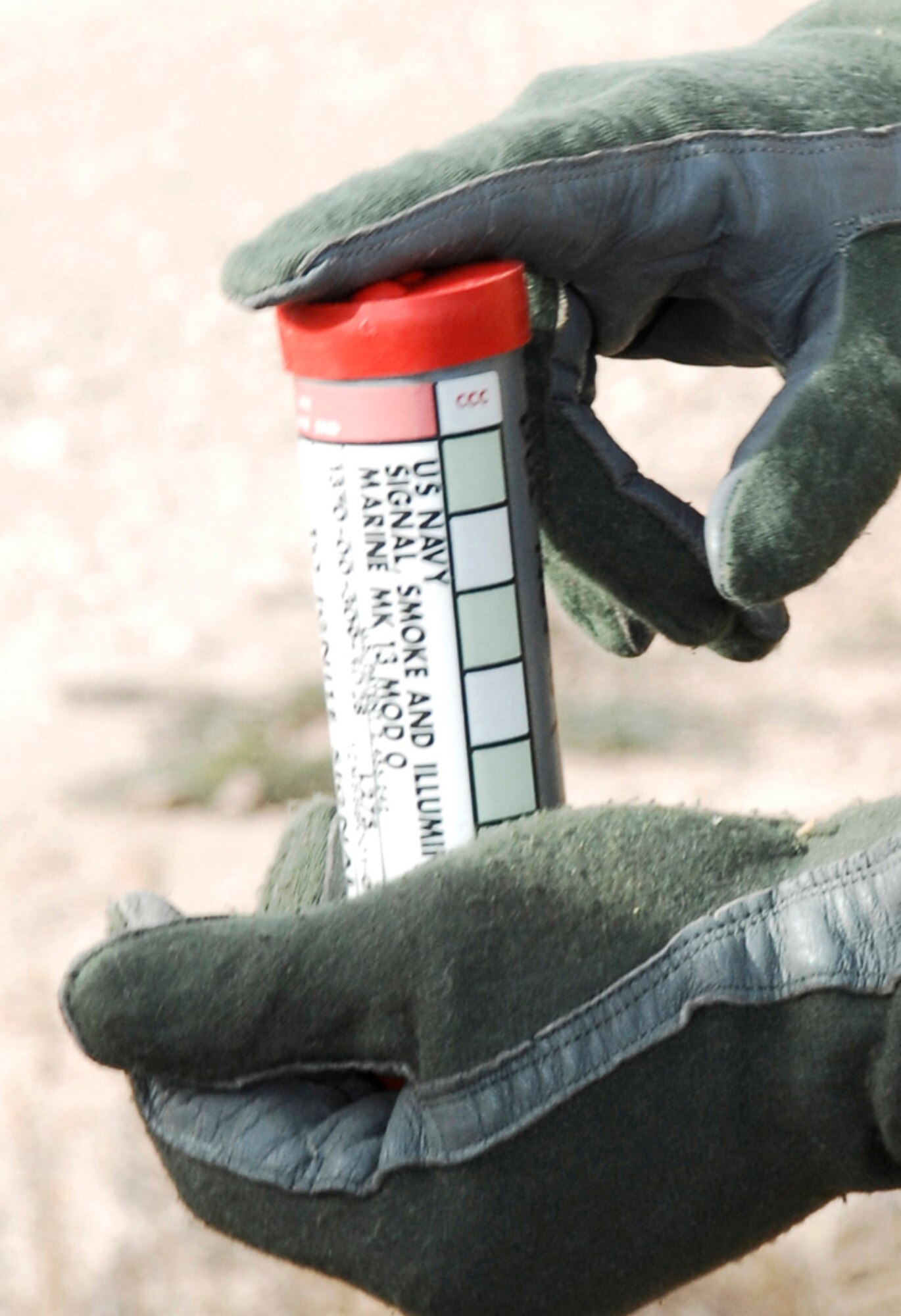 CANNON AIR FORCE BASE, N.M. -- Tech. Sgt. Marc Richard, an instructor of the 27th Special Operations Support Squadron Survival Evasion Resistance Escape program, teaches various components of survival and evasion using a MK-13 signal flare during Code of Conduct Continuation Training. (U.S. Air Force photo/Airman 1st Class Danielle Martin)