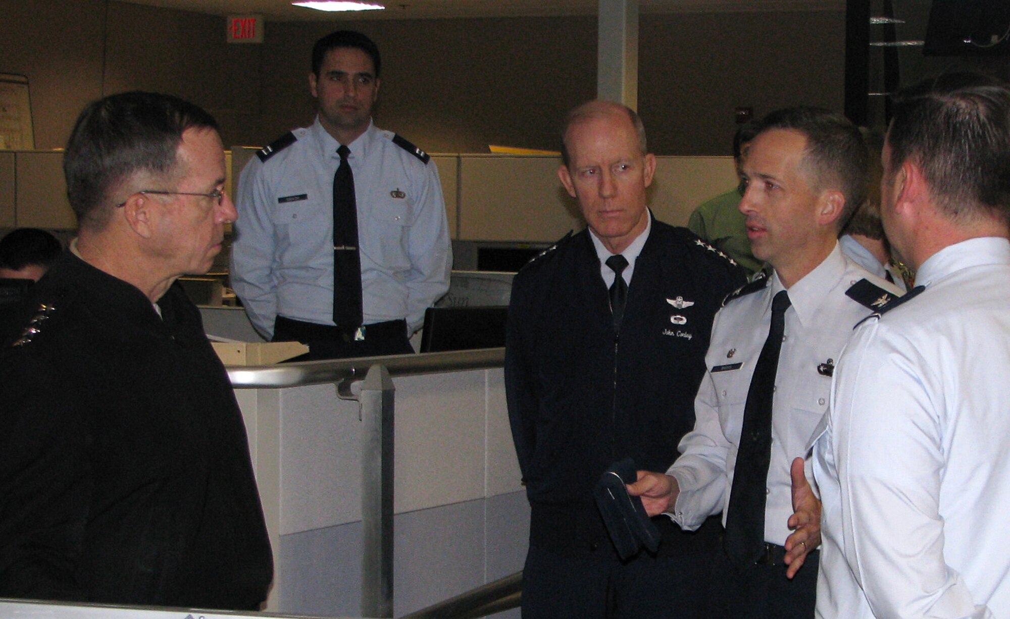 Col. James Marrs, 480th Intelligence Wing Commander, accompanied by Gen. John D.W. Corley, ACC Commander, briefs the Chairman of the Joint Chiefs of Staff Admiral Michael Mullen about the Wing's mission.  The CJCS toured the Wing Operation Center and the Distributed Ground System-1 at the 480th IW during his visit to Langley Air Force Base, Va., Dec. 8. (US Air Force photo/Staff Sgt. Michael Edmond)