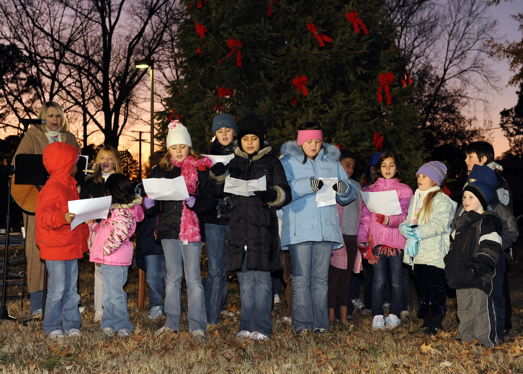 LANGLEY AIR FORCE BASE, Va. -- The Bethel Manor Chapel choir sings Christmas songs during the Christmas tree lighting ceremony Dec. 7. The lighting of the Christmas tree is an annual event that kicks off the Christmas season. (U.S. Air Force photo/Airman 1st Class Jonathan Koob)