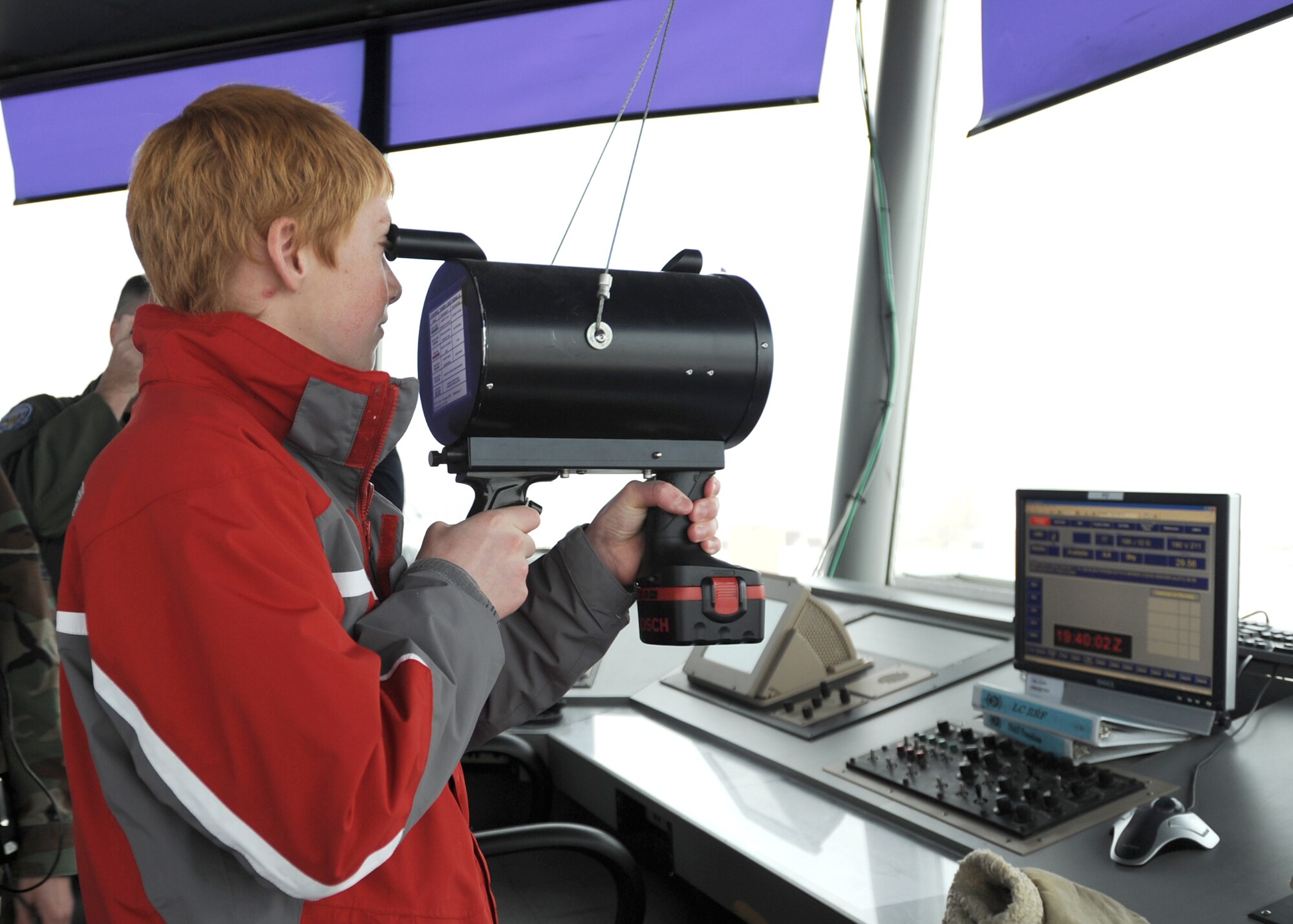 Andrew Allen visits Grand Forks Air Force Base's control tower during his trip to the base Dec. 5. Andrew, a victim of Crohn's Disease, came to the base as a part of the "Pilot for a Day" program. (U.S. Air Force photo by Staff Sgt. Suellyn Nuckolls)