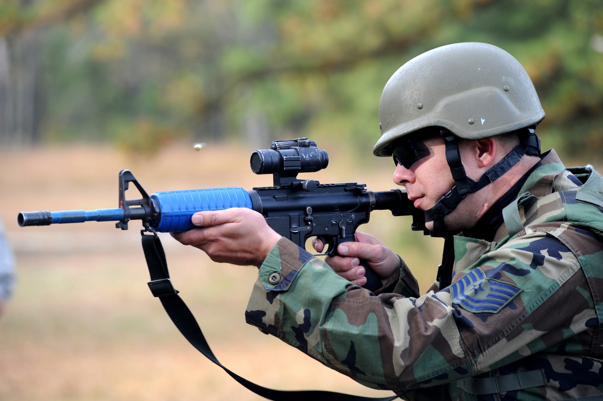 Tech. Sgt. Keith Vershay, paralegal craftsman for the U.S. Air Force Expeditionary Center and instructor in the Judge Advocate Advanced Contingency Skills Training Course, demonstrates a correct firing stance as he fires simulated rounds at a target on a Fort Dix, N.J., range Oct. 24, 2008.  Sergeant Vershay was demonstrating for students in functional-specific training course for Airmen in the Air Force legal career field.  During four days of the functional specific training, Sergeant Vershay and another instructor led training on operations law instruction, contingency skills basics, rules of engagement on the use of force and expeditionary basics.  The training is held prior to the students attending the core ACST Course taught by the 421st Combat Training Squadron. (U.S. Air Force Photo/Staff Sgt. Nathan Bevier)