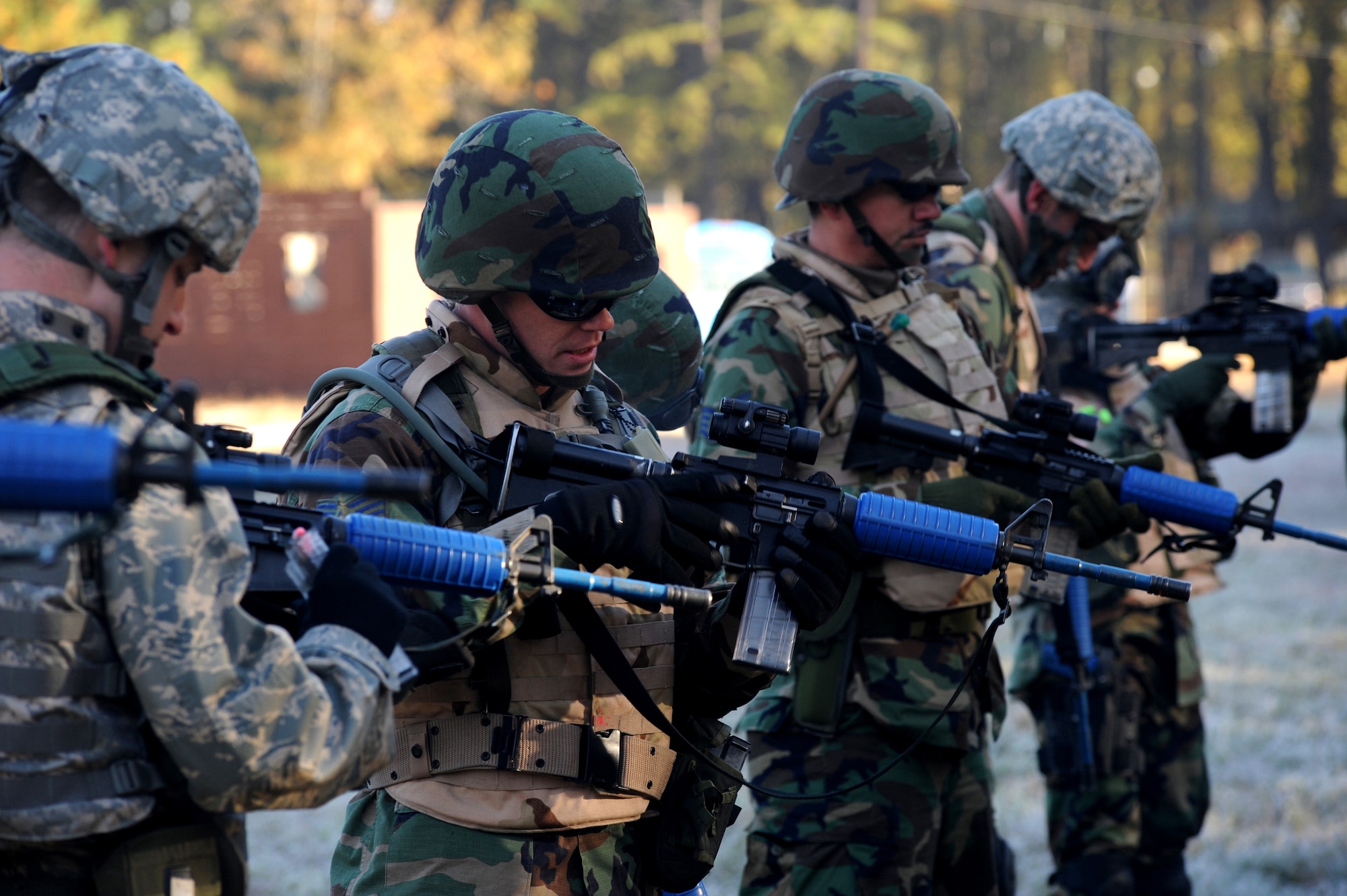 Students clear their weapons while participating in field training on a Fort Dix, N.J., range Oct. 24, 2008, as part of training in the Judge Advocate Functional Advanced Contingency Skills Training Course.  The course is functional-specific training for Airmen in the Air Force's legal career field focusing on operations law instruction, contingency skills basics, rules of engagement on the use of force and expeditionary basics taught by the U.S. Air Force Expeditionary Center's JA staff. The training is held for four days prior to the students attending the core ACST Course taught by the 421st Combat Training Squadron, also on Fort Dix. (U.S. Air Force Photo/Staff Sgt. Nathan Bevier)