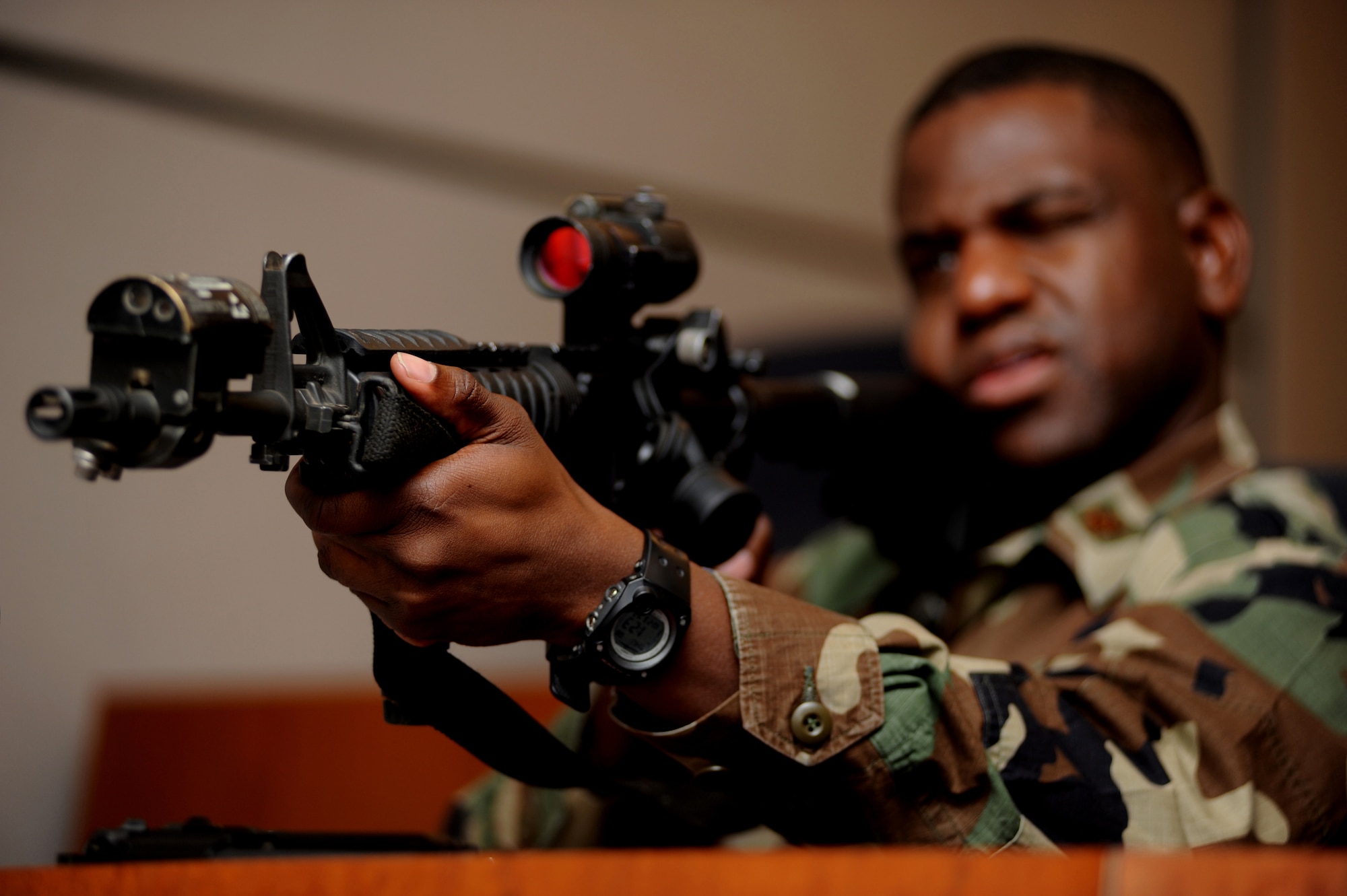 Maj. Damund Williams learns the fundamentals of an M-4 rifle during a weapons familiarization class, Oct. 23, 2008, as part of training in the Judge Advocate Functional Advanced Contingency Skills Training Course in the U.S. Air Force Expeditionary Center on Fort Dix, N.J.  The course is functional-specific training for personnel within the Air Force's legal career field focusing on operations law instruction, contingency skills basics, rules of engagement on the use of force and expeditionary basics taught by the Center's JA staff.  The training is held for four days prior to the students attending the corse ACST Course taught by the Center?s 421st Combat Training Squadron, also on Fort Dix.  Major Williams is assigned to Tinker Air Force Base, Okla.. (U.S. Air Force Photo/Staff Sgt. Nathan Bevier)