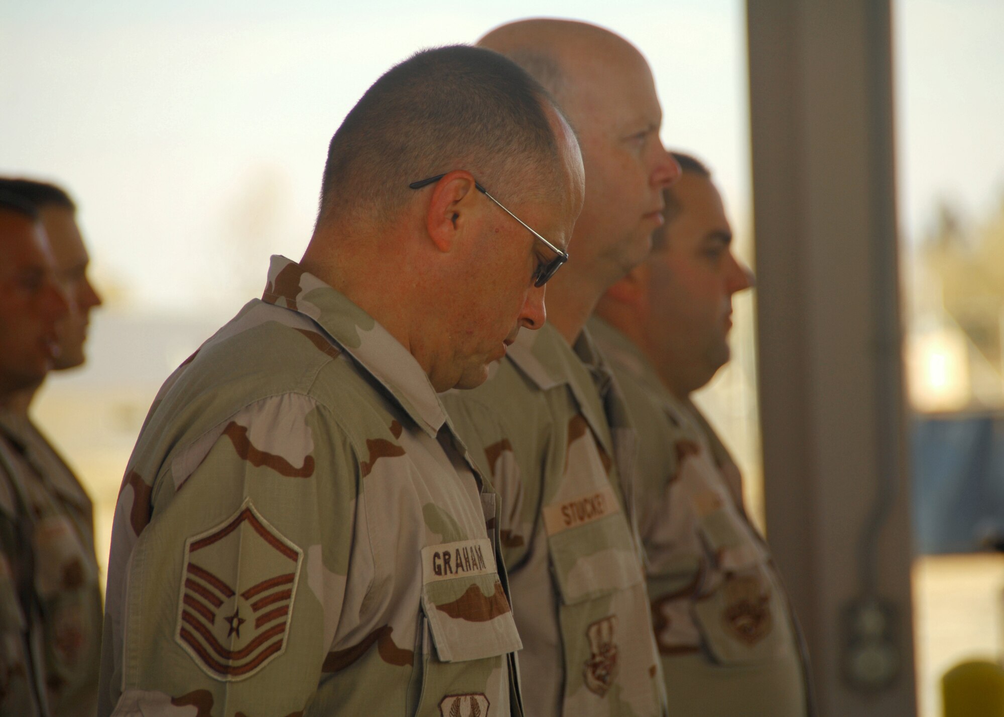 SOUTHWEST ASIA -- Master Sgt. Timothy Graham grieves at the memorial ceremony for a fallen firefighter, Senior Airman Joseph Martinez on Dec. 8 at an air base in Southwest Asia. Airman Martinez was a firefighter from the 156th Airlift Wing, Puerto Rico Air National Guard, and was deployed to the 386th Expeditionary Civil Engineer Squadron from April through September 2008. (U.S. Air Force photo/Tech. Sgt. Raheem Moore)