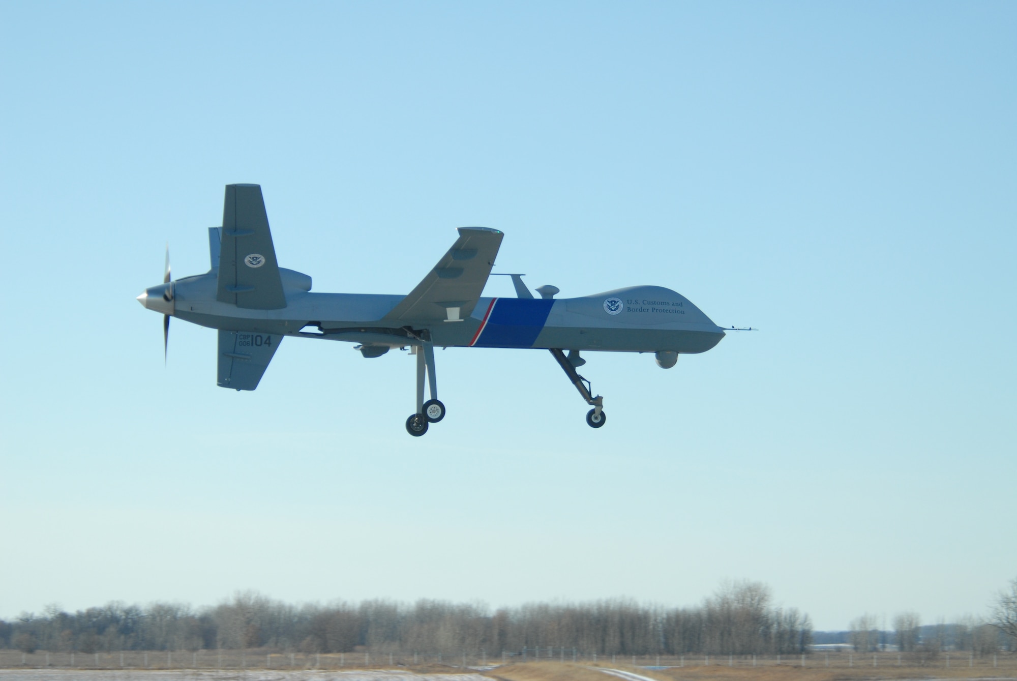 The first Predator B Unmanned Aircraft System on the northern border flies into Grand Forks Air Force Base on Dec. 6. This system – in use since 2005 on the southwest border – will enhance border security efforts and support Customs and Border Patrol personnel on the ground along the northern border with Canada. (U.S. Air National Guard photo by Senior Master Sgt. David Lipp)