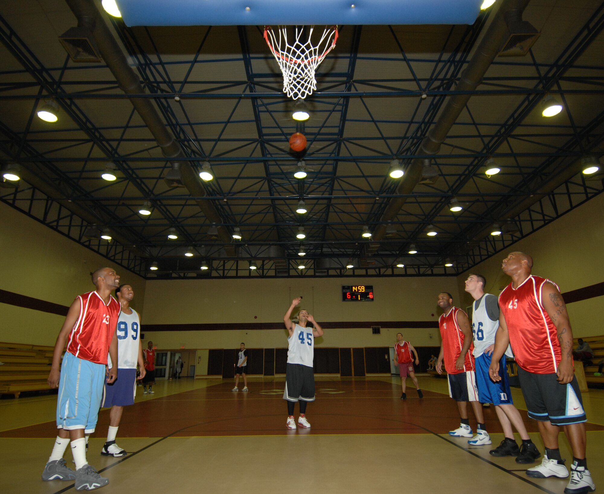 The 817th Expeditionary Airlift Squadron and 39th Medical Group teams anticipate the rebound after David Trouche, 817 EAS shoots a free throw during an intramural basketball game, Dec. 4. The 817 EAS team defeated the 39 MDG team 52 – 46. (U.S. Air Force photo by Senior Airman Benjamin Wilson)