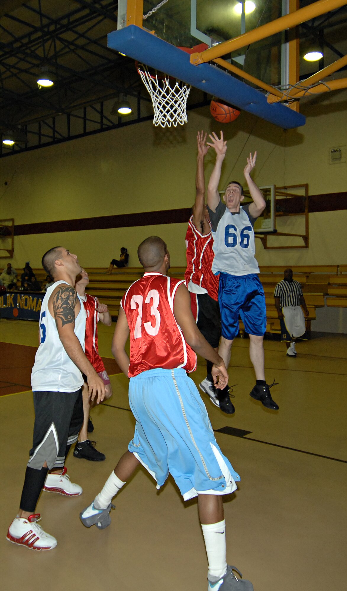 Karl Scheuerman, 817th Expeditionary Airlift Squadron, shoots a fade-away jumper from inside the key during an intramural basketball game, Dec. 4. The 817 EAS team brought down the 39th Medical Group team with a final score of 52 – 46. (U.S. Air Force photo by Senior Airman Benjamin Wilson)