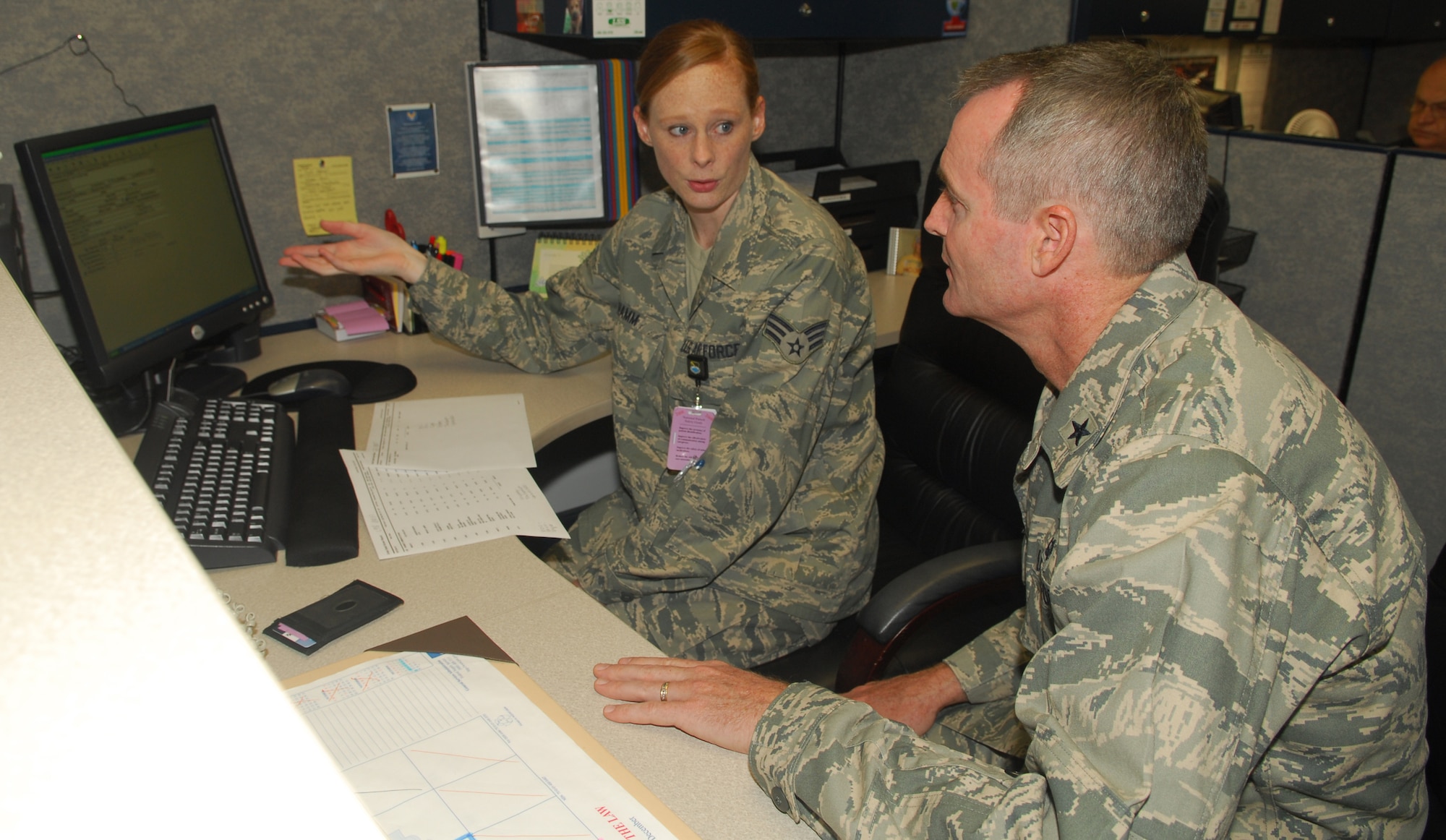 Senior Airman Brandy Hamm, 325th Medical Support Squadron Medical Logistics journeyman, explains her job duties to Brig. Gen. Darryl Roberson, 325th Fighter Wing commander.  Airman Hamm, selected for the Commander’s Shadow Program,  is responsible for maintaining user access for 148 customers and performing system updates and is the Tyndall Active Airman’s Association president   “She is a role model for Airman of all ranks,” said Staff Sgt. Dustin Salz, Airman Hamm’s supervisor and nominator.  Serving in the Air Force for two years, Airman Hamm hails from Wichita, Kan.  (U.S. Air Force photo by Lisa Norman)