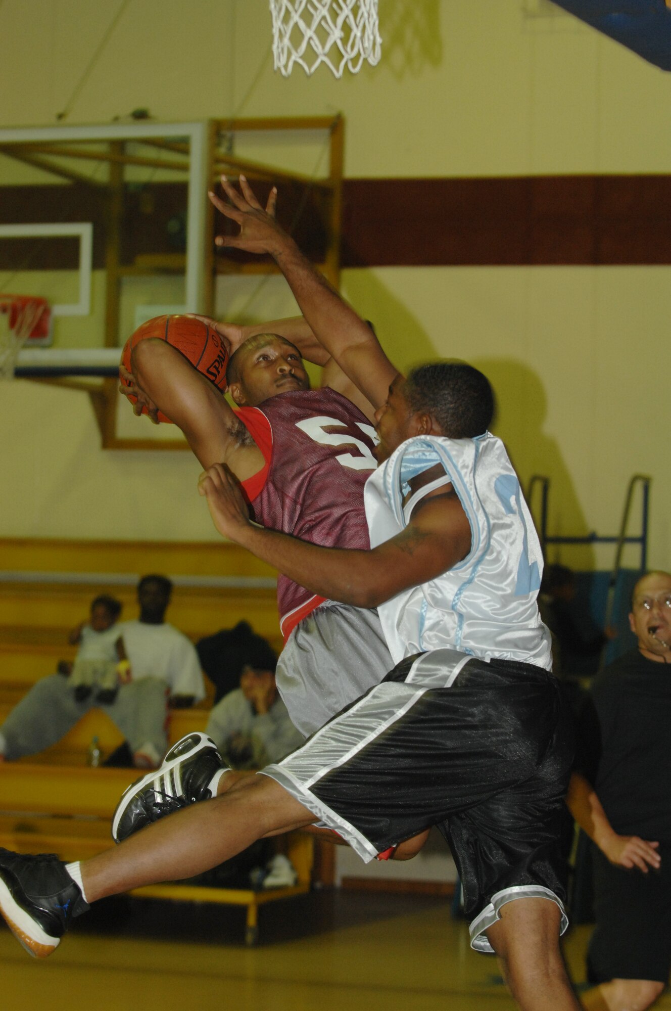 Bobby Curry, 39th Communications Squadron, attempts to sink a shot during an intramural basketball game. The 39 CS team went on to beat the 728th Air Mobility Squadron team 47 – 42. (U.S. Air Force photo by Senior Airman Benjamin Wilson)