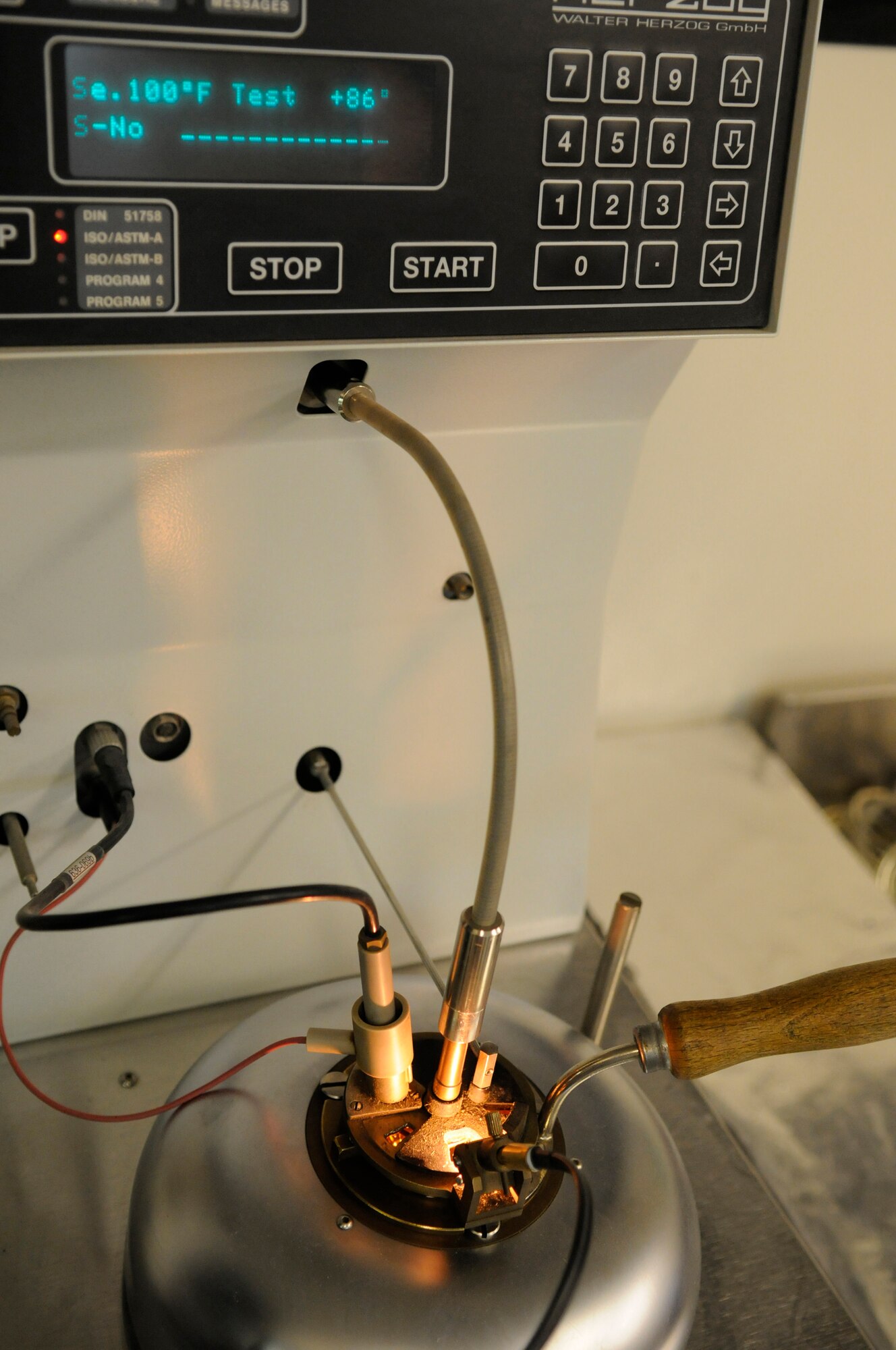 Staff Sgt. Ronald Gasper, a fuels lab technician assigned to the 379th Expeditionary Logistics Readiness Squadron, uses a flash tester to perform a flash point test, Dec. 8, at an undisclosed air base in Southwest Asia. The flash point test is used to determine the temperature at which the fuel will ignite.  The fuel is slowly warmed and every two degrees an ignition coil is briefly exposed over the fuel to identify how hot the fumes must be to ignite.  Sergeant Gasper, a native of Omaha, Neb., is deployed from Scott Air Force Base, Ill., in support of Operations Iraqi and Enduring Freedom and Joint Task Force-Horn of Africa.  (U.S. Air Force photo by Tech. Sgt. Michael Boquette/Released)
