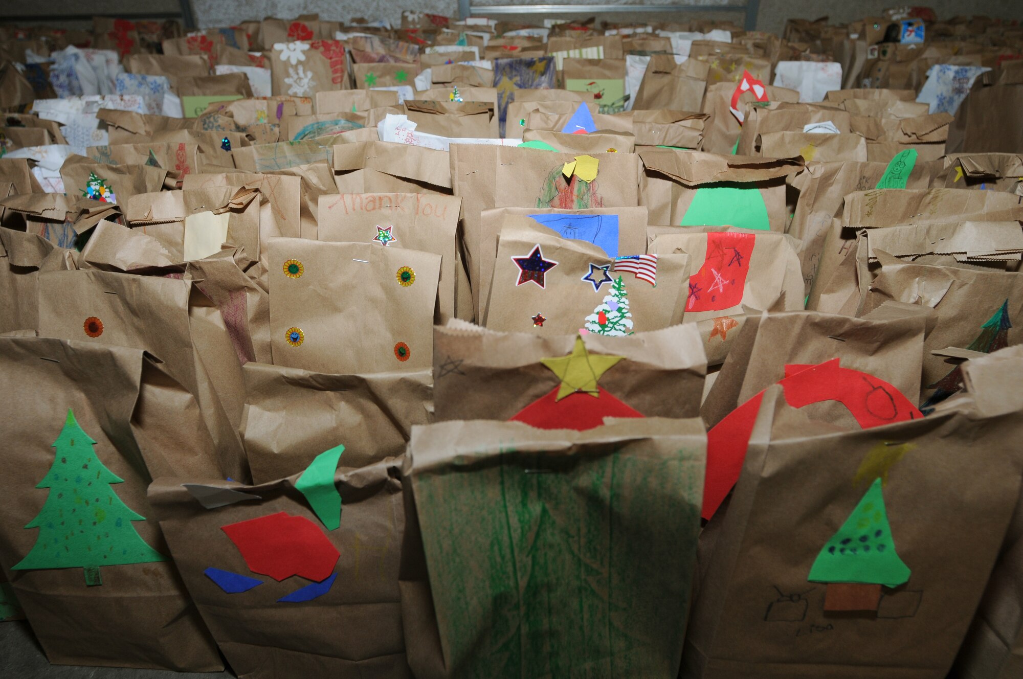 Volunteers helped fill more than 1,100 gift bags to send downrange for Project Rudolph, Rhine Ordnance Barracks, Germany, Dec 6, 2008. A total of 2,850 bags have been assembled here in Germany. (U.S. Air Force photo by Senior Airman Kelly LeGuillon)
