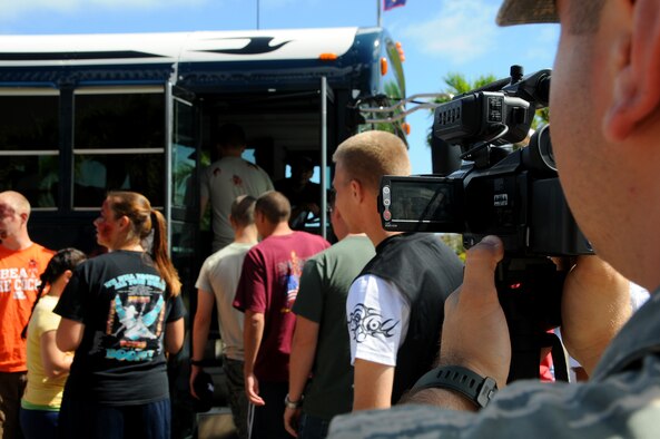 ANDERSEN AIR FORCE BASE, Guam - Senior Airman Steven Donatelli, 36th Wing Public Affairs videoagrapher, documents an Emergency Management Exercise here Dec. 3. The exercise tested the bases reaction during a dirty-bomb simulation.  (U.S. Air Force photo by Airman 1st Class Courtney Witt)