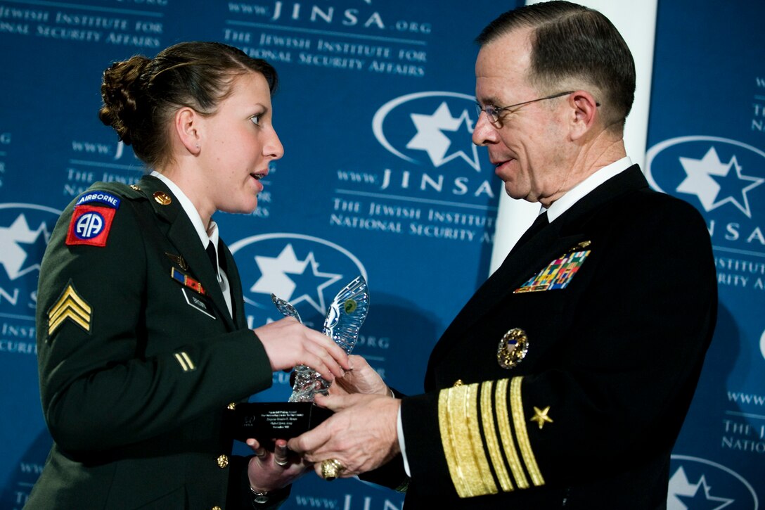 U.S. Navy Adm. Mike Mullen, chairman of the Joint Chiefs of Staff, presents U.S. Army Sgt.  Monica L. Brown with the 2008 Jewish Institute for National Security Affairs Grateful Nation Award, Crystal City, Va., Dec. 8, 2008.  