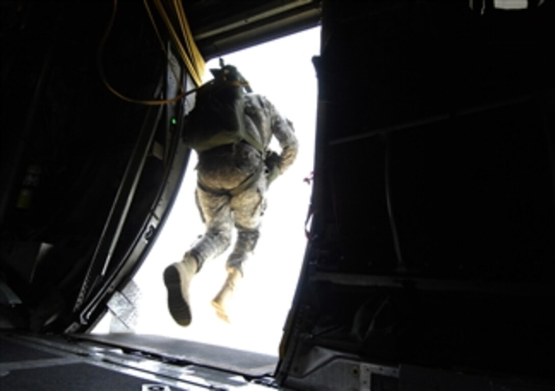 A U.S. Army soldier from the 82nd Airborne Division, Fort Bragg, N.C., parachutes from a C-130 Hercules aircraft during Operation Toy Drop at Fort Bragg, N.C., on Dec. 6, 2008.  Operation Toy Drop is an annual airborne jump at Fort Bragg, N.C., hosted by the U.S. Army Civil Affairs and Psychological Operations Command (Airborne) and supported by Fort Braggís XVIII Airborne Corps and Pope Air Force Base's 43rd Airlift Wing.  In support of the exercise, soldiers donate a toy for a lottery ticket giving them the chance to jump under a foreign jumpmaster to earn their foreign jump wings.  