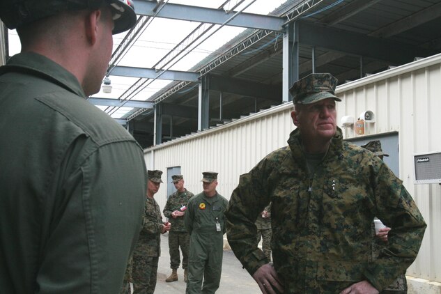 Lt.Gen. Richard Natonski, commander, U.S. Marine Corps Forces Command (right), talks with Sgt. Peter Towle, technical rescue technician, Chemical Biological Incident Response Force, II Marine Expeditionary Force, (left). During Natonski’s visit, Towle showed him how to stabilize a structure using shoring.