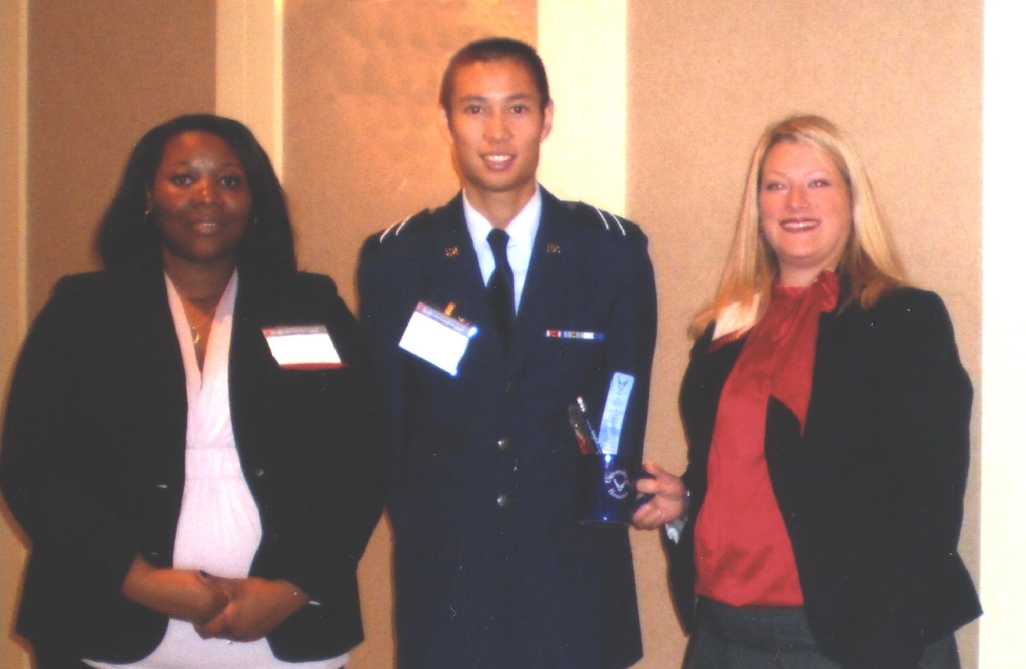 AFOSR representatives Amber McCants (left) and Lauren Bickel (right) pose with a cadet in attendance at the University of Houston's Third Annual Department of Defense Research Conference on November 13, 2008. (Image courtesy of Lauren Bickel)