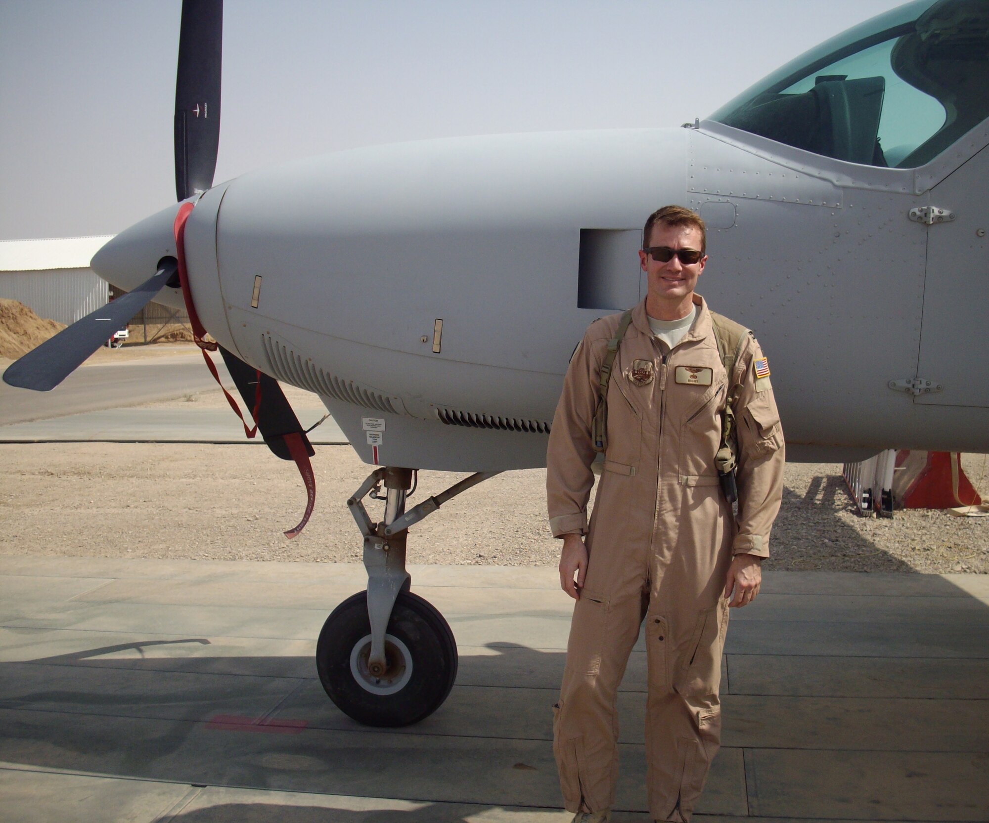 Capt. Brian Riggle, assigned to the 32nd Flying Training Squadron at Vance Air Force Base, stands in front of a Cessna 172 Skyhawk at Forward Operating Base Warrior, Kirkuk, Iraq. During his career, Captain Riggle has flown T-37 Tweets, T-1 Jayhawks, C-5 Galaxies, Cessna 172 Skyhawks and 208 Caravans, and is assigned fo fly C-17 III Globemasters next. (Courtesy photo)