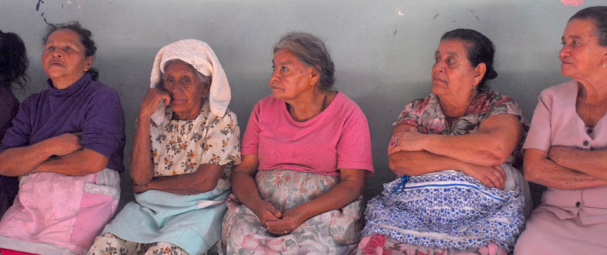 AJUTERIQUE, Honduras - Local women wait Dec. 9 for their turn to receive a free gift basket containing essential food and supplies from Joint Task Force-Bravo. Locals here were victim to widespread flooding across Honduras recently. (U.S. Air Force photo by Staff Sgt. Joel Mease)