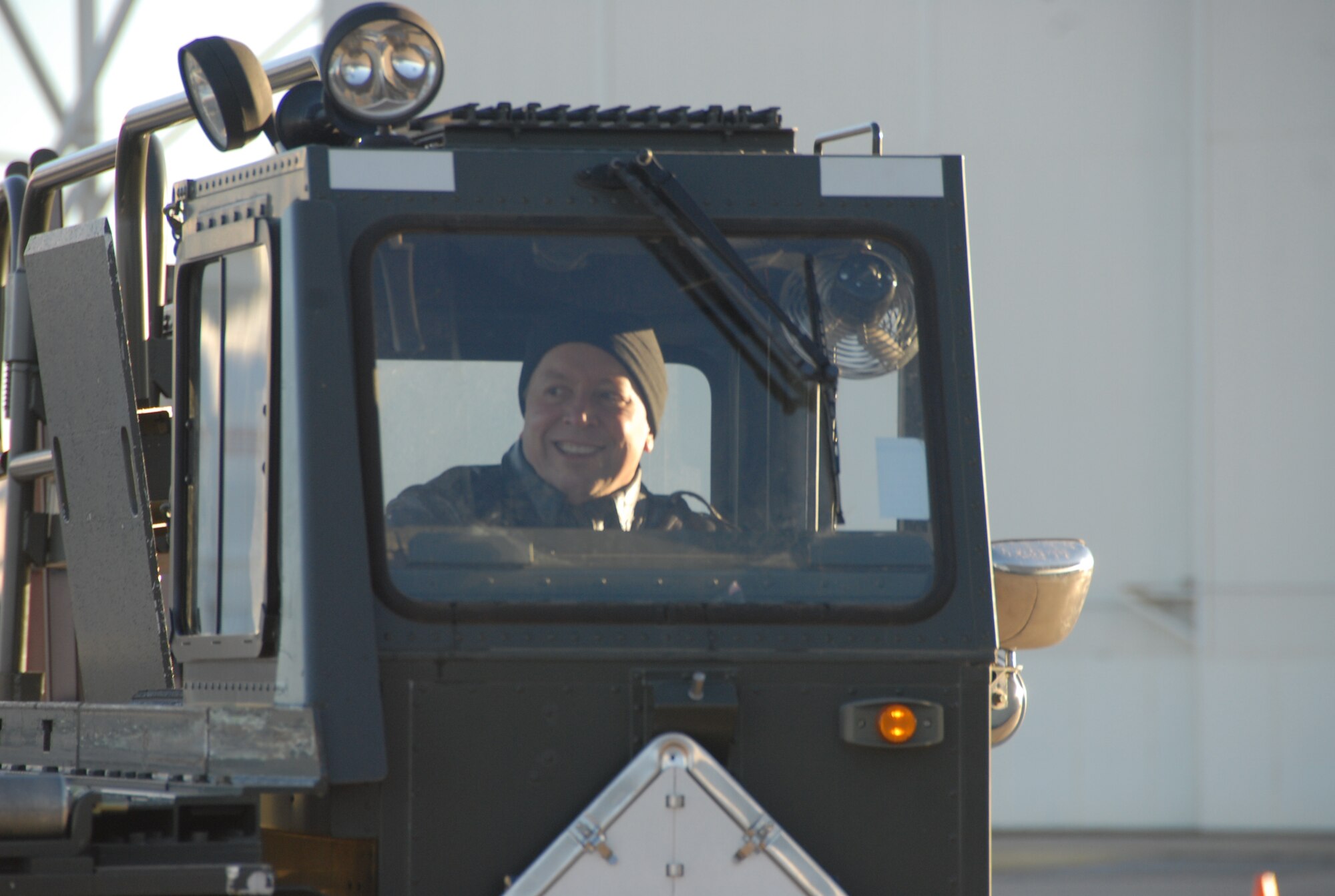 ALTUS AIR FORCE BASE, Okla. -- Proving himself a capable vehicle operator, Maj. Gen. Gregory Feest, 19th Air Force commander, enjoys his ride in a 60K cargo loader. The general went through the Altus course, used to certify loader operators, without any difficulties or hit cones. (U.S. Air Force photo/Airman 1st Class Cherice I. Bryant)