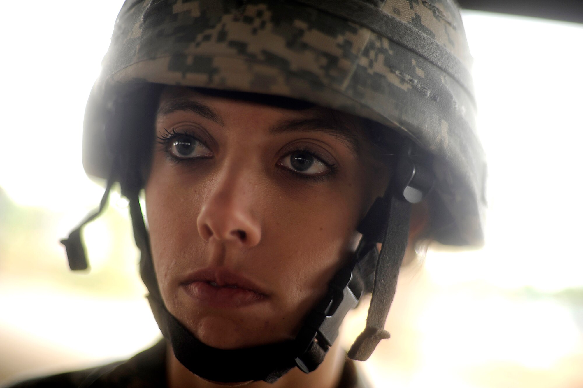 Army Spc. Ashley Beck from the 82nd Airborne Division from Fort Bragg, N.C., attends parachute landing fall class Dec. 5 before the Operation Toy Drop jump at Pope Air Force Base, N.C. Operation Toy Drop is an annual Airborne jump at Fort Bragg in its 11th year hosted by the Army Civil Affairs and Psychological Operations Command (Airborne), and supported by Fort Bragg's XVIII Airborne Corps and the Air Force Reserve Command's 440th Airlift Wing at Pope AFB that gives Soldiers and Airmen the opportunity to help local families in need over the holidays while boosting morale and incorporating valuable training. More than 3,000 Soldiers donated a toy for a lottery ticket and the chance to jump under a foreign jumpmaster, earning them their foreign jump wings. This year, German and Irish jumpmasters will be issuing the commands from C-130 Hercules aircraft during the operation. (U.S. Air Force photo/Tech. Sgt. Jeremy Lock) 
