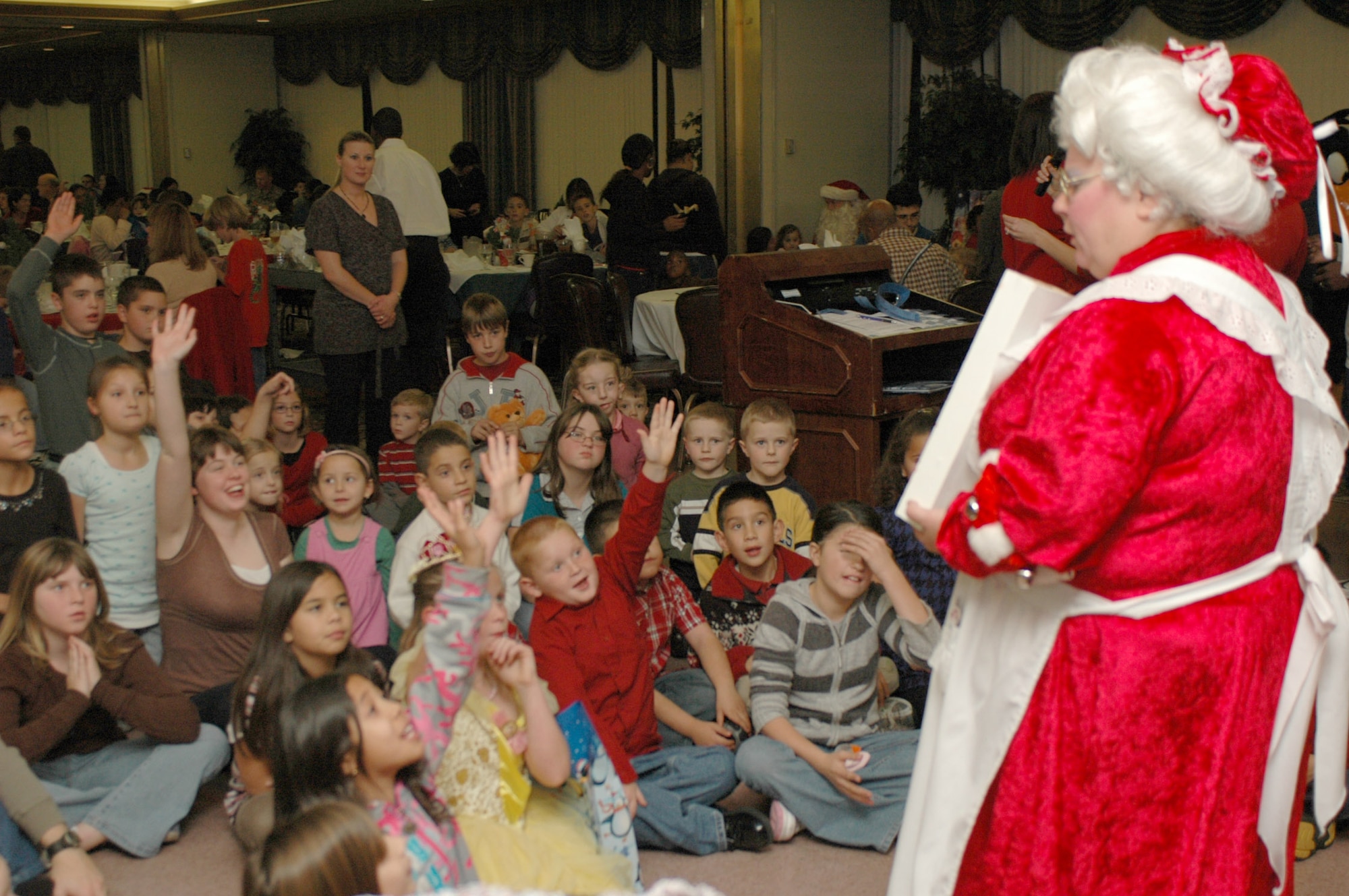 Mrs. Clause puts on a magic show at this year’s Special Needs Holiday Party Dec. 9 at the Travis Conference Center. (U.S. Air Force photo/Staff Sgt. Shaun Emery)