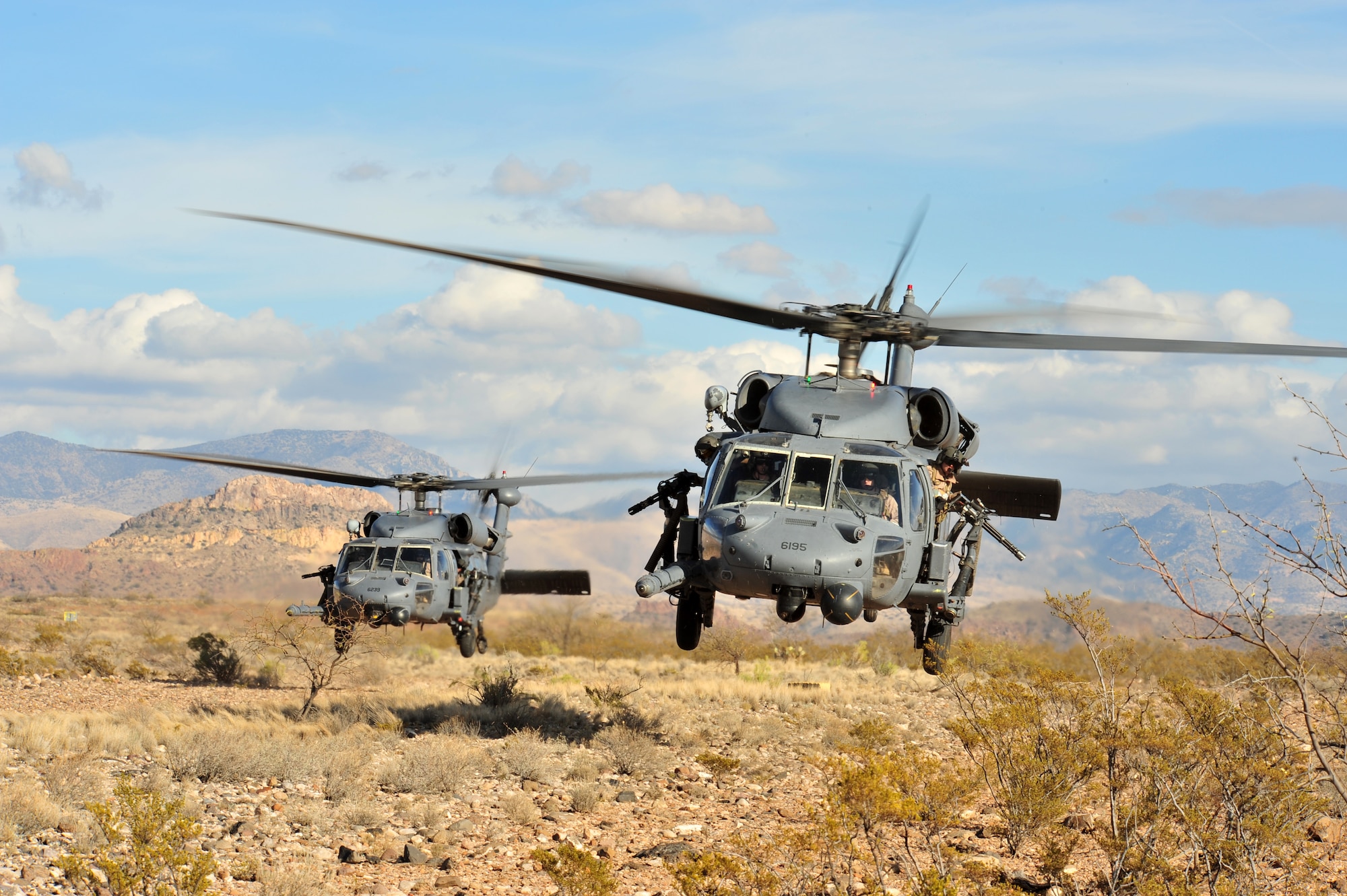 Two HH-60 Pavehawk helicopters land during a personnel recovery training exercise, Angel Thunder 2008. More than 800 ground recovery personnel took part in Angel Thunder 08, the world's largest personnel recovery and combat search and rescue exercise. (U.S. Air Force photo/Senior Airman Noah R. Johnson)
