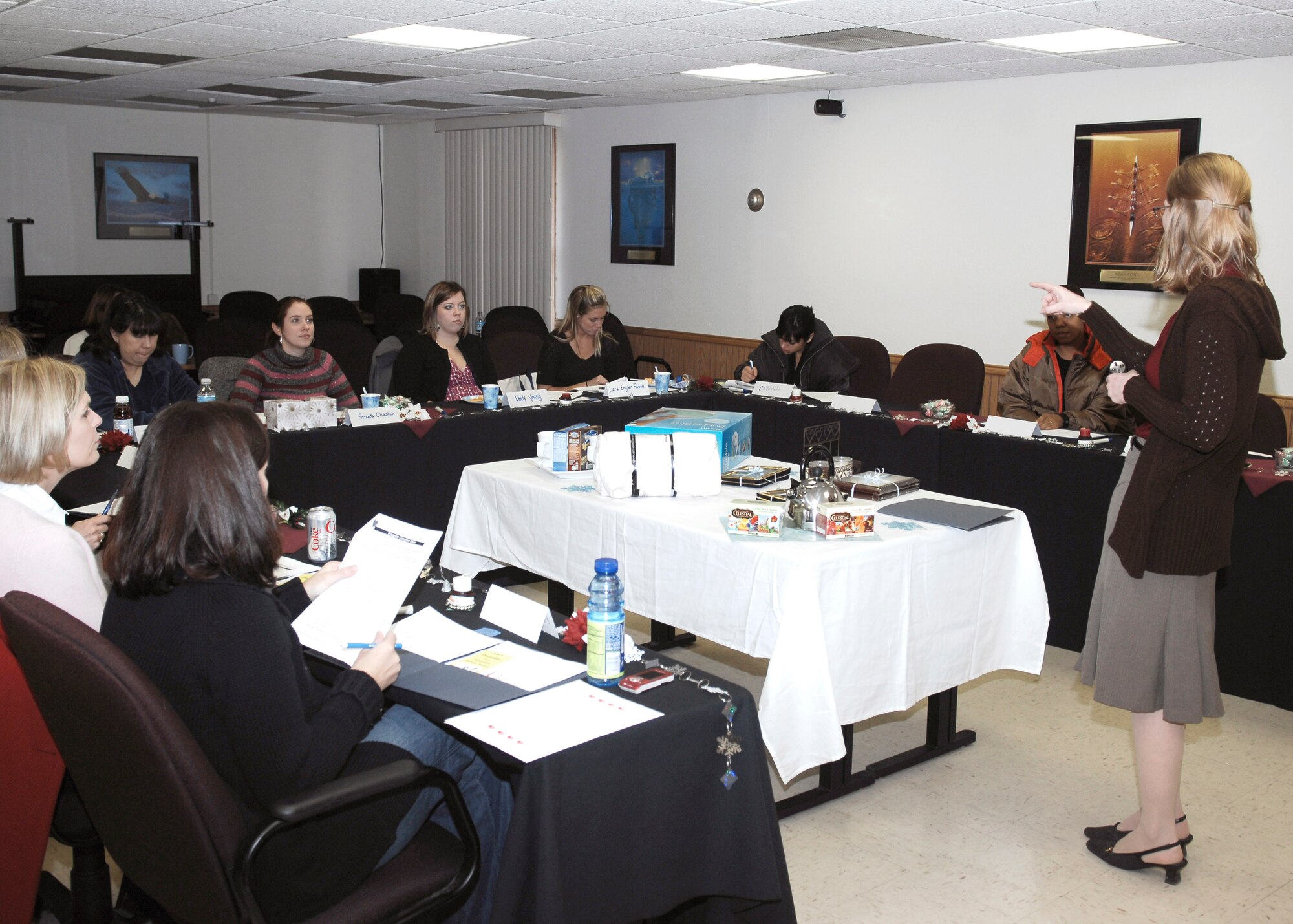 CANNON AIR FORCE BASE, N.M. - - Jennifer Johnson, an Airman and Family Readiness Center representative, welcomes military spouses to the Heart Link briefing on Dec. 5. Heart Link informs new military spouses about the traditions of the Air Force and what to expect from life with the the 27th Special Operations Wing.(U.S. Air Force photo/Airman 1st Class Danielle Martin) 