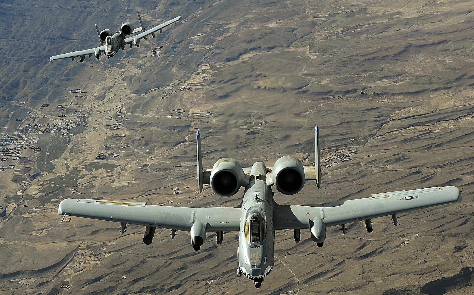 Two A-10 Thunderbolt IIs in-flight over Afghanistan.  A-10s provide convoy escort support for ground forces and armed aerial overwatch over Afghanistan in support of Operation Enduring Freedom. (U.S. Air Force photo/Staff Sgt. Aaron Allmon)