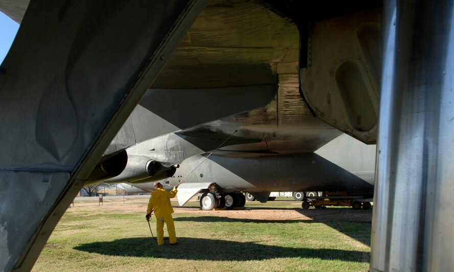 A volunteer washes the wing of a Boeing B-52 at the 8th Air Force Museum Airpark located on Barksdale Air Force Base, La., Dec 5. The maintenance marks the beginning of the renovation to the outside of the bomber. (U.S. photo by Airman 1st Class Brittany Y. Bateman)(Released)