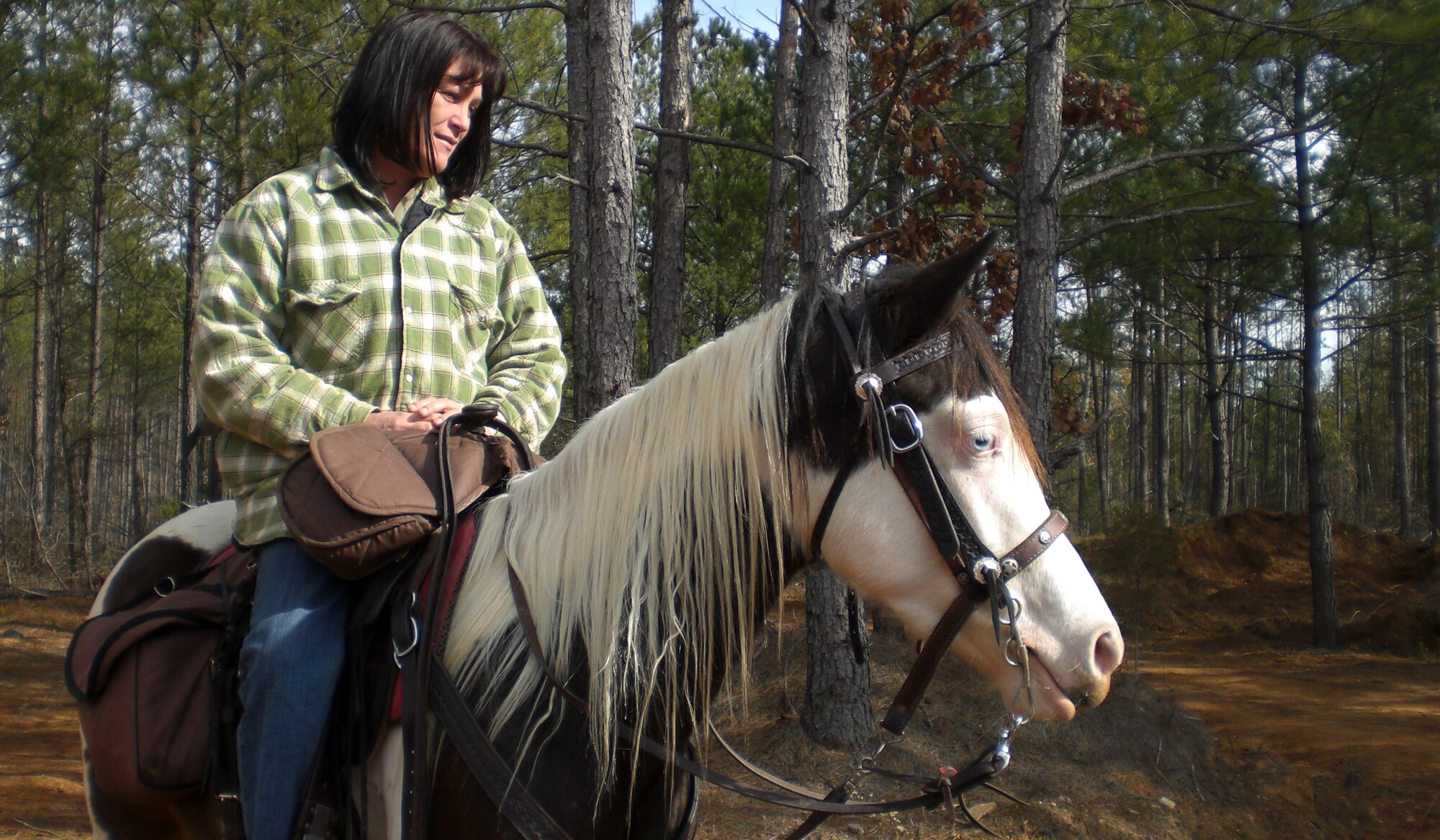 SHAW AIR FORCE BASE, S.C. -- Horseback rider Tammy Bowden sits ready to ride her horse Nikhia, Saturday, Dec. 7 at Double J Ranch in Whitmire, S.C. as part of a three-day benefit ride, Hoofin? for Heroes.  The proceeds from Hoofin? for Heroes directly go toward the Wounded Warrior Project, a nonprofit organization that seeks to assist men and women of the U.S. armed forces who have been severely injured in conflicts overseas. (U.S. Air Force photo/2nd Lt. Noelle Caldwell)