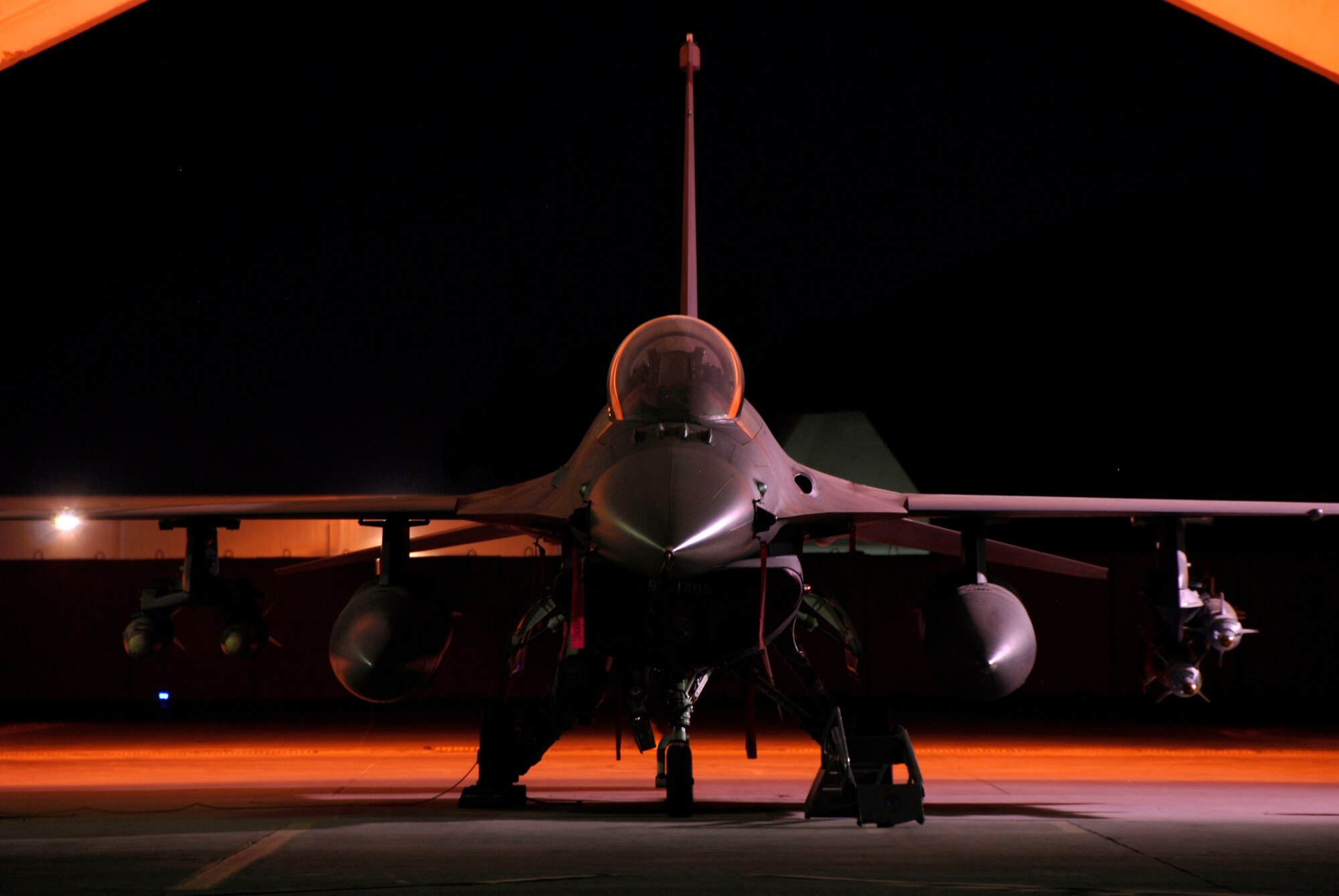 An F-16 Fighting Falcon is housed in a hardened aircraft shelter with a pilot ready 24 hours a day to fly missions in alert status. The Fighting Falcon is from the 332nd Expeditionary Fighter Squadron at Joint Base Balad, Iraq. (U.S. Air Force photo/Master Sgt. Daniel Richardson)