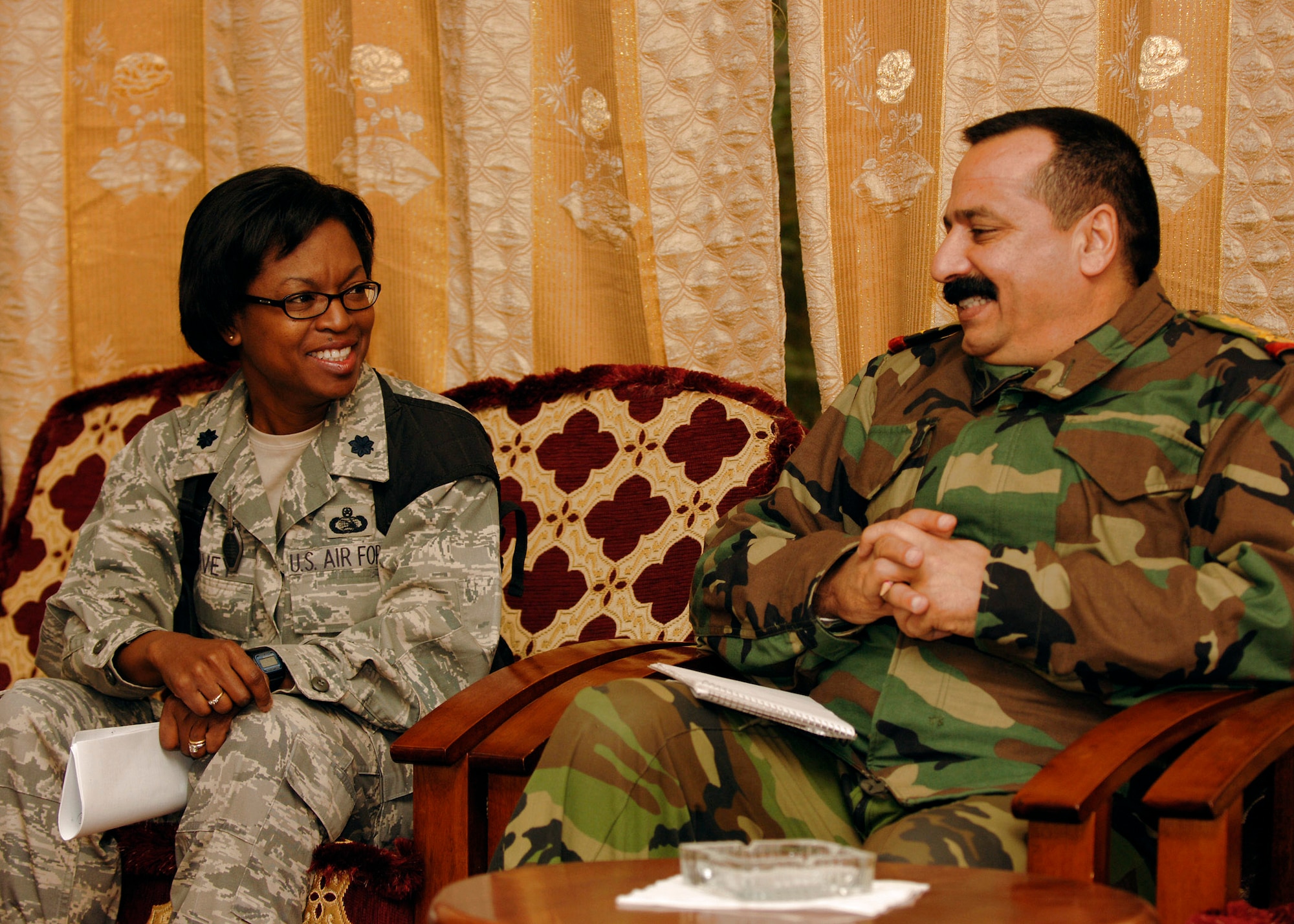 Lt. Col. Jeri Harvey discusses upcoming projects with Iraqi army staff Brig. Gen. Abdul Mahady Sharaque Sabah Nov. 23 at Taji Military Base, Iraq. Colonel Harvey is the senior adviser for the logistics military advisory team and a native of St. Louis. She is the adviser to General Sabah, the Taji Location Command commander. (U.S. Air Force photo/Staff Sgt. Paul Villanueva II) 
