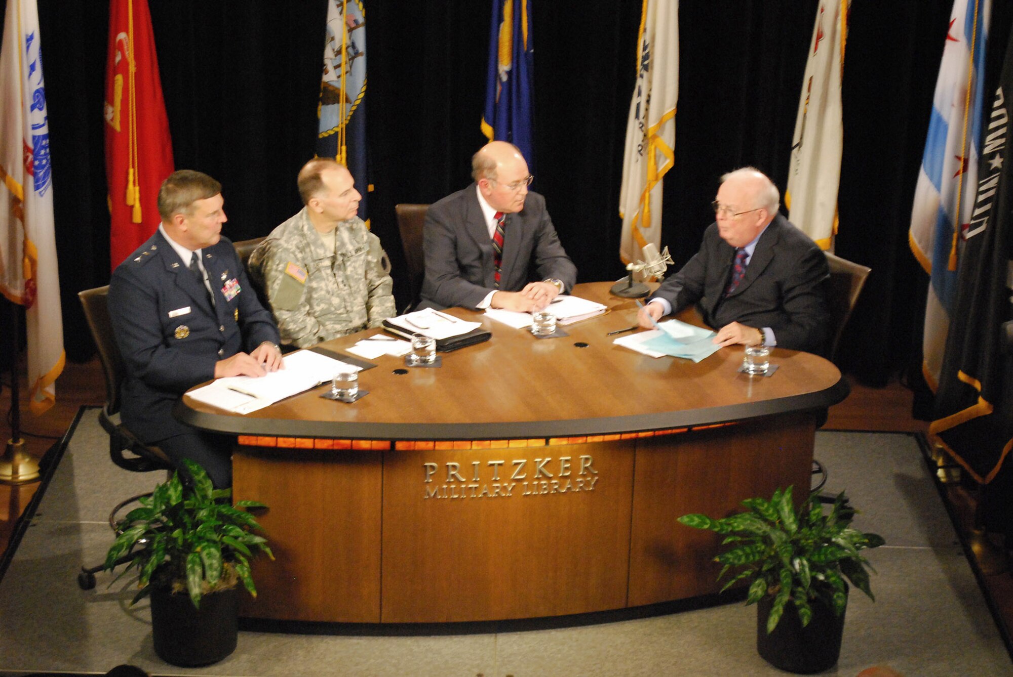 Major Gen. Robert E. Duignan participates in a panel discussion on Reserve and Guard forces with Army Maj. Gen. William L. Enyart, Dr. John D. Winkler and moderator John Callaway Dec. 4 in Chicago. The panel was part of "Front and Center" a worldwide Web cast and locally televised military public affairs program produced by the Pritzker Military Library in Chicago. General Duignan is the 4th Air Force commander, and General Enyart is the Illinois adjutant general. Dr. Winkler is the principle deputy assistant secretary of Defense for Reserve affairs  (U.S. Air Force photo/Senior Airman Zach Anderson) 
