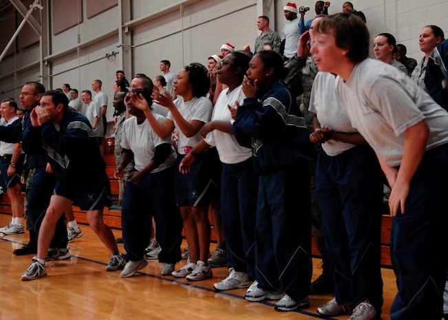 Airmen of Team Charleston cheer during the tug-of-war match on Charleston AFB Dec. 5.  More than 100 Charleston Airmen participated in the Commander's Fitness Challenge. The 437th Logistics Readiness Squadron won the overall competition. (U.S. Air Force photo/Airman 1st Class Katie Gieratz)