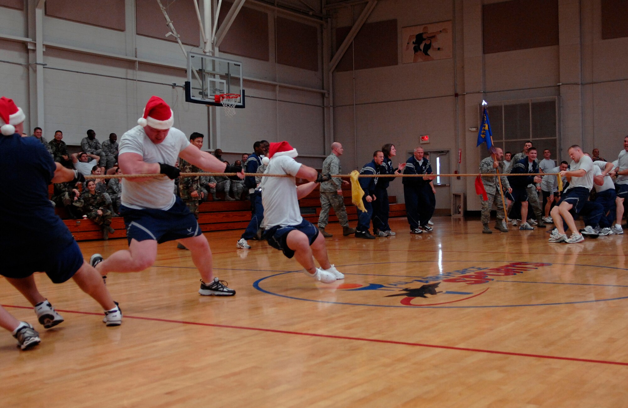 Members of the 437th Security Forces Squadron compete against the 437th Civil Engineer Squadron during the tug-of-war match at the Fitness and Sports Center on Charleston AFB Dec. 5. More than 100 Charleston Airmen participated in the monthly Commander's Fitness Challenge to build espirit de corps and promote physical fitness. The 437th Logistics Readiness Squadron won the overall competition. (U.S. Air Force photo/Airman 1st Class Katie Gieratz)
