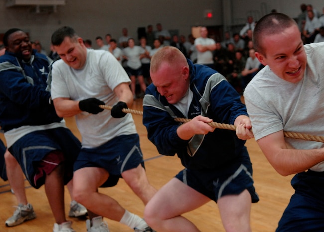 Airmen of the 437th Operations Support Squadron pull on the rope during the tug-of-war match at the Fitness and Sports Center on Charleston AFB Dec. 5. More than 100 Charleston Airmen participated in the Commander's Fitness Challenge. The 437th Logistics Readiness Squadron won the overall competition. (U.S. Air Force photo/Airman 1st Class Katie Gieratz)