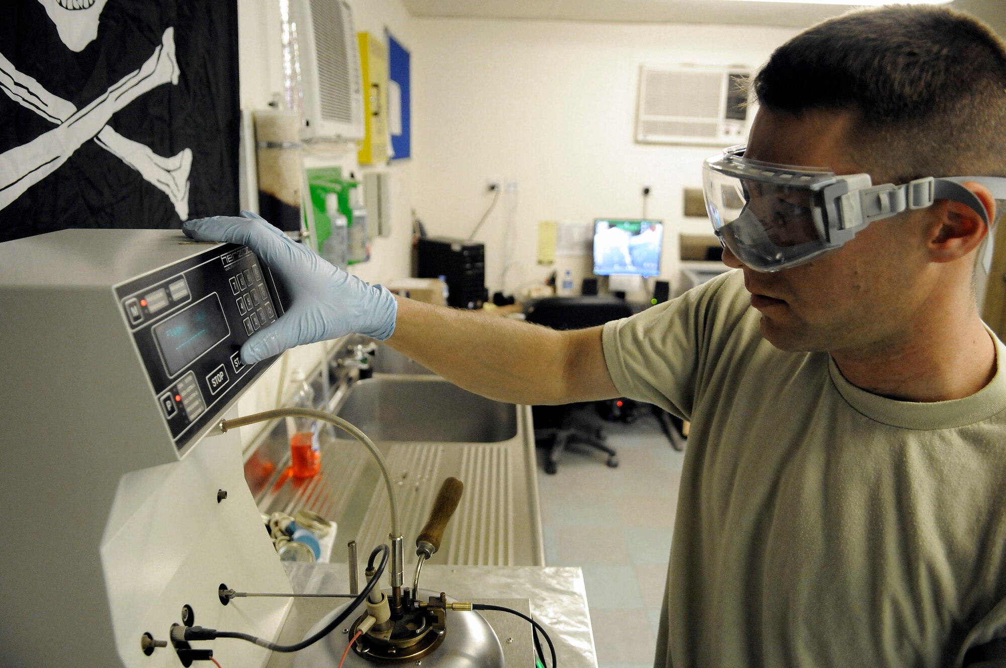 Staff Sgt. Ronald Gasper conducts a flash point test Dec. 8 at an air base in Southwest Asia. The flash point test is used to determine the temperature at which the fuel will ignite. The fuel is slowly warmed and every 2 degrees an ignition coil is briefly exposed over the fuel to identify how hot the fumes must be to ignite. Sergeant Gasper is a fuels lab technician assigned to the 379th Expeditionary Logistics Readiness Squadron and deployed from Scott Air Force Base, Ill. He is a native of Omaha, Neb. (U.S. Air Force photo/Tech. Sgt. Michael Boquette) 
