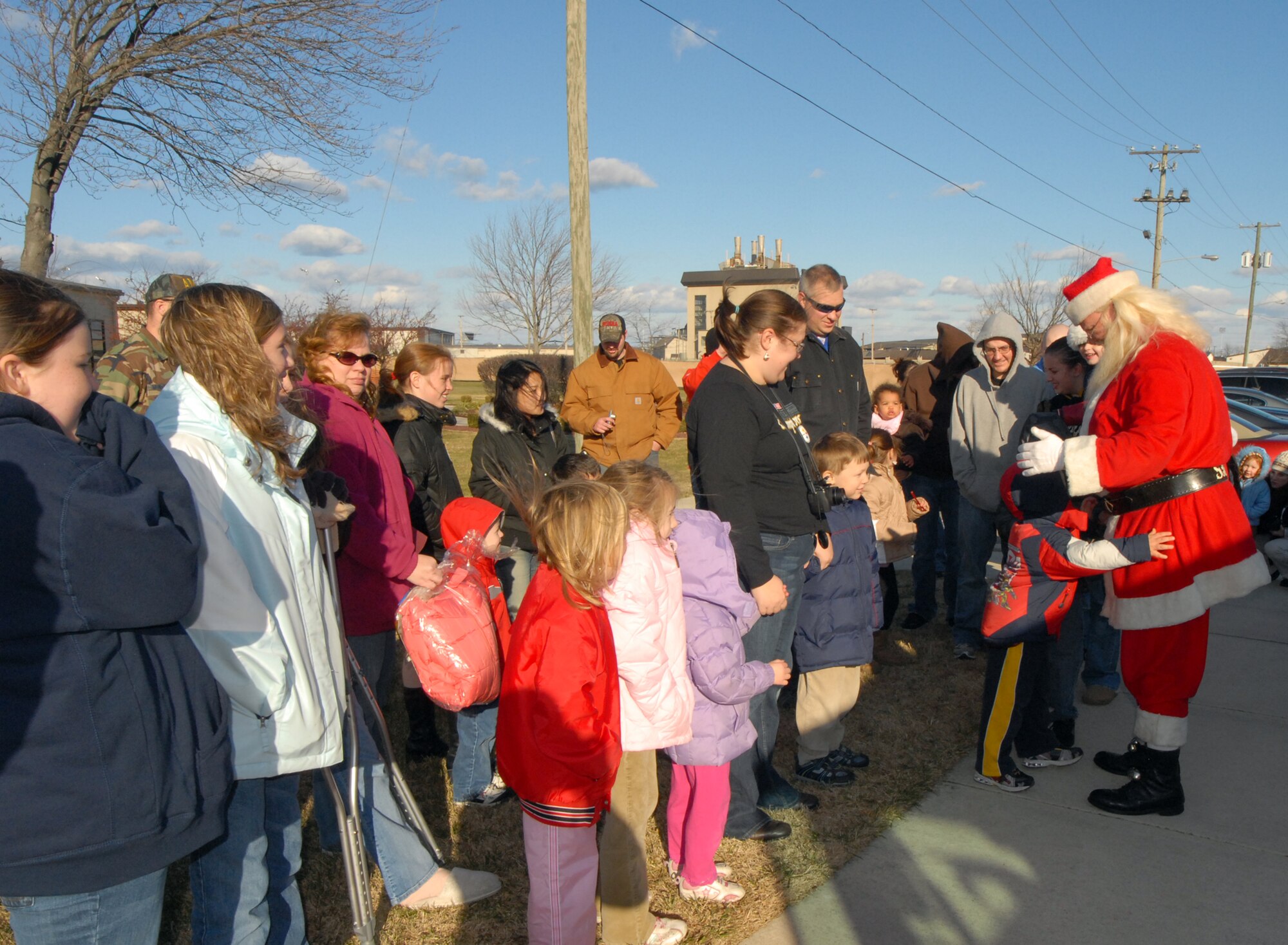 Team Dover children and parents waited outside The Landings Club to be the first to greet Santa during the 2008 Wing Children’s Christmas Party Sunday. Santa was ferried to the event on a Dover Air Force Base fire engine. (U.S. Air Force photo by Tech. Sgt. Kevin Wallace)